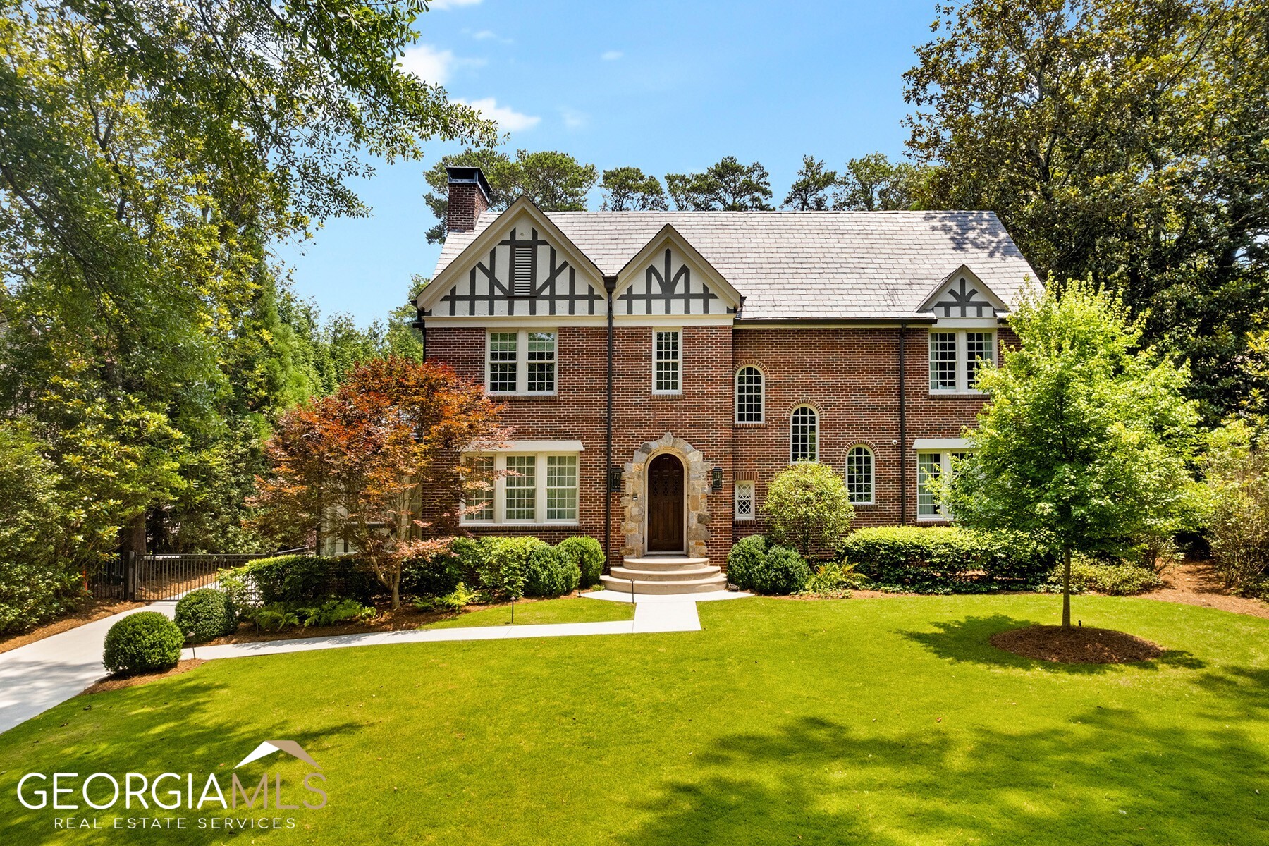 Introducing a masterfully renovated gem, nestled within the prestigious Druid Hills neighborhood. Enjoy this timeless 1925 Classic Tudor home boasting a perfect blend of historical charm and modern luxury. This meticulously restored residence offers a stunning Primary suite and bath with his and hers closets overlooking an amazing private backyard. There are 4 other bedrooms and 4.5 baths in the main home and a fully equipped separate carriage house. The home boast with elegant design and contemporary amenities. The kitchen is a dream kitchen everyone wants today. You will find yourself in a world of refined beauty, where each room tells a story of craftsmanship and attention to detail. Experience the allure of this architectural masterpiece, where history meets the comforts of modern living, creating an unparalleled living experience in the heart of Druid Hills on one of the most sought-after streets.