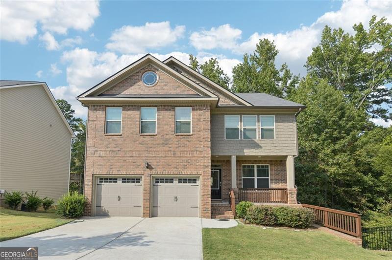 This 2019 dream home blends modern design with everyday comfort in a layout that truly works. With 4 bedrooms, 3 full baths, and thoughtful details throughout, it offers a warm, inviting feel the moment you walk in. Natural light fills the open-concept kitchen, complemented by laminated floors throughout and clean, modern accent walls. The spacious family room centers around a cozy fireplace-perfect for both relaxing nights and casual gatherings. Step outside to a two-level deck designed for entertaining, or enjoy quiet mornings on the charming front porch. The full, unfinished basement provides endless potential: home office, gym, studio-you decide. Tucked in a peaceful community just minutes from the interstate, this home offers a balance of privacy and convenience, plus $3,000 toward closing costs with a preferred lender. Contact your agent today to schedule a showing.