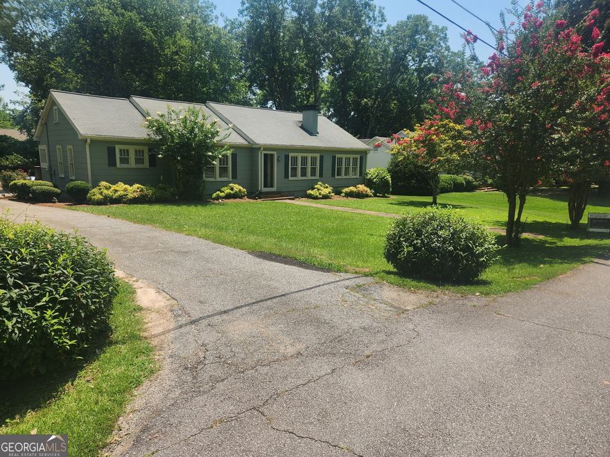 Welcome to this charming ranch home located in Carrollton City limits.  Hardwoods floors throughout this home.  Open style kitchen with a separate dining room.  3 bedroom, 2 bathrooms and an extra room can be used for office or another bedroom.  Walk or ride your golf cart to the greenbelt.  Also, conveniently located to West Georgia College.  This home is not located in a subdivision and no HOA requirements.