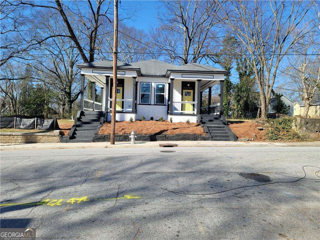 Welcome home! This classic renovation, located in Historic Vine City is on a great street a stone's throw away from the Belt-Line! You will love the Covered rocking chair front porch and being minutes from Mercedes Benz Stadium, Georgia Aquarium, and Grove Park. This home features gorgeous flooring, updated bathrooms recessed lighting, modernized kitchen, Brand-new electricity, plumbing, flooring, windows, walls, full length back deck, fenced backyard and unmatched style throughout the home. Do not miss your opportunity at this property!