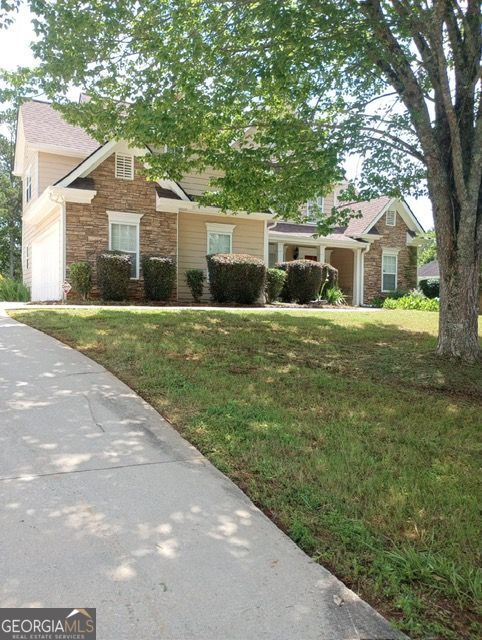 Beautifully Maintained 3-Bedroom 2.5 Bathroom Rental. Discover comfort and convenience in this meticulously maintained 3-bedroom, 2.5- bathroom residence located in a quiet and well-established neighborhood in Conyers. This home offers a functional layout, modern finishes, and inviting spaces perfect for everyday living and entertaining. The spacious owner's suite is conveniently located on the main level, providing ease of access and privacy. The open-concept family room features soaring ceilings, a cozy fireplace, and seamlessly flows into the breakfast area and gourmet kitchen. The kitchen is equipped with granite countertops, upgraded appliances, stained cabinetry, and generous counter space ideal for preparing meals and hosting guests throughout the year. The expansive formal dining room comfortably accommodates 8 to 12 guests, making it ideal for private dinners or family gatherings. Its convenient proximity to the kitchen allows for effortless serving and seamless entertaining. A graceful staircase leads to the upper level, which includes to additional bedrooms, a versatile flex room, and a loft area perfect for a home office, quiet reading nook, or game space. Additional features include a two car side entry garage, a beautiful leveled backyard ideal for outdoor gatherings and close proximity to local shopping, dining, schools and entertainment. Don't miss the opportunity to call this exceptional home yours. Schedule your private tour today.