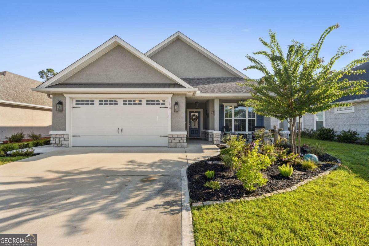 Coastal Living at Its Best - 3BR/2BA 2,354 sq. ft. Built 2022 ?Don't miss this stunning home that blends modern comfort with thoughtful upgrades inside and out. Featuring 3 bedrooms, 2 bathrooms, and 2,354 sq. ft., this residence is designed for both relaxation and entertaining. The heart of the home boasts a spacious kitchen with stainless steel appliances, wrap-around island, updated backsplash, Bosch dishwasher, custom pullouts in cabinets, and additional pantry shelving. The laundry room has been upgraded with custom cabinetry for extra storage. The primary suite is a true retreat with California closets, new granite countertops, updated sinks & faucets, a standalone tub with tile surround, and upgraded shower fixtures. Step outside to enjoy coastal living with a screened-in back porch, shark-coated front & back porches, fenced yard, new landscaping, concrete walkway, and a covered HVAC/garbage enclosure with latch door. Interior & Exterior Upgrades Include: Vinyl flooring in bedrooms, Replaced windows throughout, All new fans & updated lighting (with dimmers, recessed lights & modern fixtures), Garage shelving & installed fan, Cordless 2" faux wood blinds throughout, New porch fan & light fixtures. This home offers style, function, and peace of mind with every detail thoughtfully enhanced. Ideally located near Kingsbay Naval Submarine Base, Jacksonville International Airport, shopping, FLETC, Brunswick, Jekyll, and St. Simons Island.