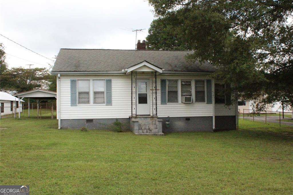 Rare opportunity to own a commercial property priced below $200,000 and listed $40,000 under appraisal! This versatile space is ideal for an insurance office, CPA firm, hair salon, or any small business needing both functionality and convenience. Featuring 2 bedrooms, a large living/front area perfect for reception or office space, a full bath, storage, and a kitchen, the property offers endless possibilities for customizing to fit your needs. The huge, level, fenced backyard provides the option for additional parking, outdoor workspace, or expansion, and includes a storage shed and a covered back porch for added flexibility. Located on a small street just off busy Fairburn Rd, you'll be surrounded by a mix of commercial buildings with great visibility and a church at the end of the street. With commercial zoning already in place, you'll save on time and expenses while enjoying instant equity. Don't miss your chance to secure this affordable property and start building your investment portfolio today!