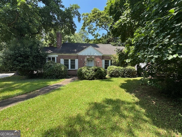 Amazing opportunity in City of Decatur. Excellent location, close to shopping, entertainment, schools, parks. Located adjacent to Wynona Park Elementary. The neighborhood has a great vibe to enjoy. Downtown Decatur and MARTA are within walking distance from the home. The family room has high ceilings and a fireplace; a cosy glassed-in sunroom is tucked in behind the fireplace. Adjacent to the family room is the spacious dining room, which leads into the kitchen, separate laundry room, and the back door. Brick 4 sides, good bones, corner level lot with fenced backyard and attached 2 car garage. A little vision will make this a dream home. It needs renovation but has newer windows, newer A/C and breaker box. Sold As-Is.