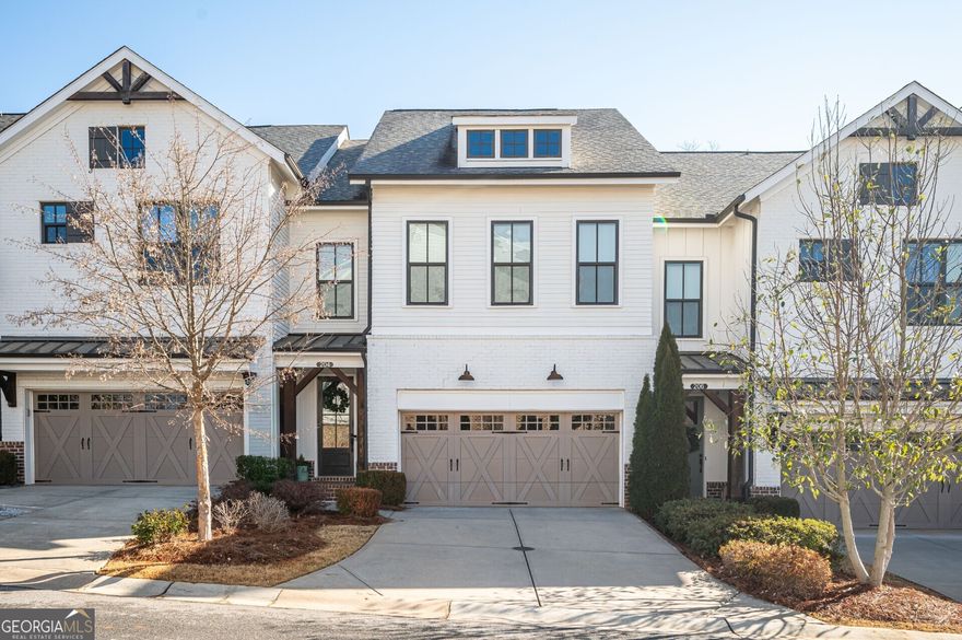 Welcome to 204 Phillips Lane, a stunning home in the desirable Chelsea Walk community of Alpharetta. Enjoy an unbeatable location with direct access to the Alpharetta Loop, connecting you to Downtown Alpharetta and Avalon for premier dining, shopping, and entertainment.    This townhome features an open floor plan with 10-foot ceilings, a spacious kitchen island, a gas-burning stove, and ample storage. Enjoy two outdoor spaces overlooking the Alpharetta Loop, plus an unfinished basement with endless potential. Upstairs, the primary suite boasts a large walk-in closet, double vanities, and a luxurious soaking tub, combining comfort and opportunity in a prime location!