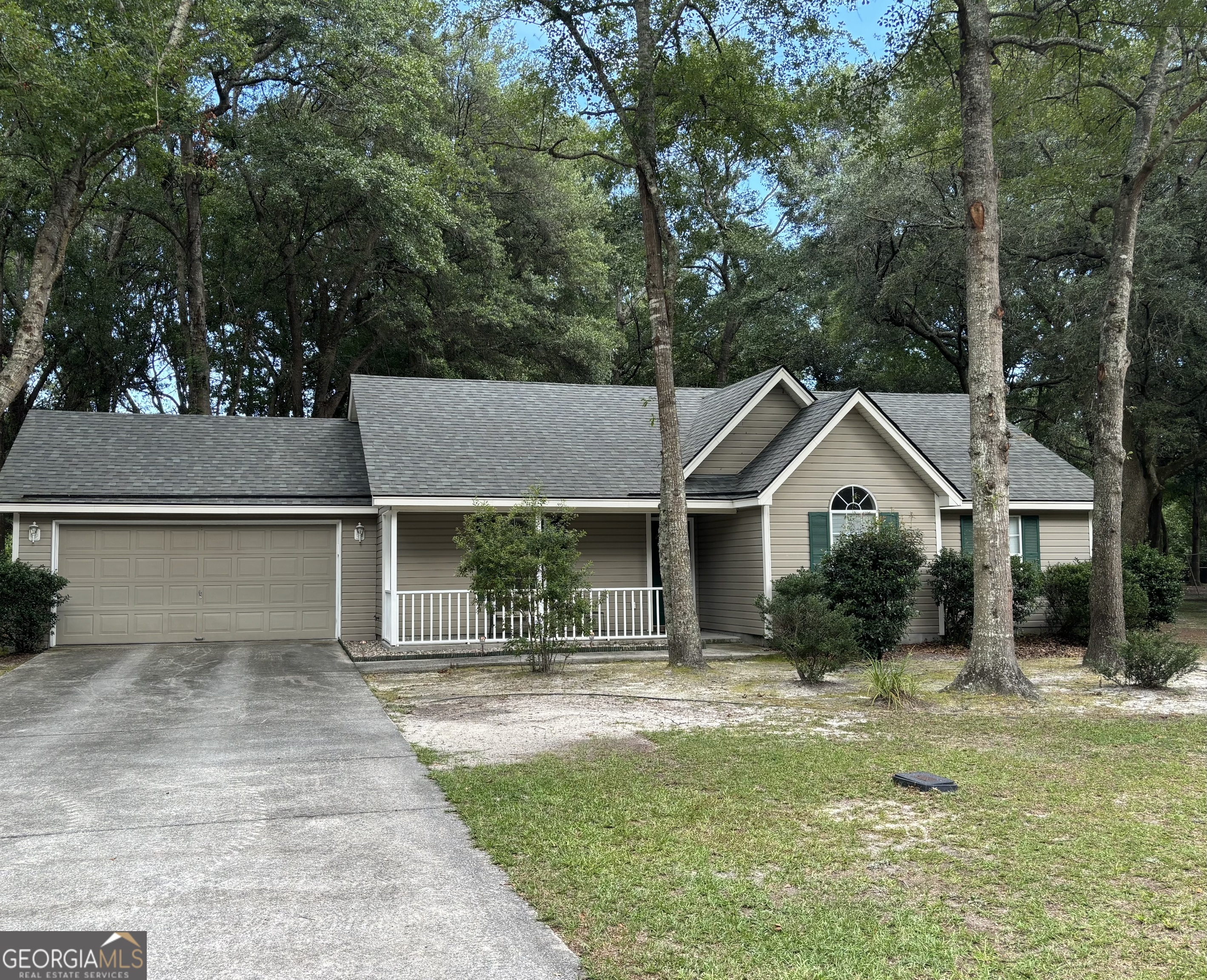 Welcome Home! This charming home in the Desirable Victoria Oaks Subdivision is 3 bedrooms 2 Bath and 1,232 SF. Custom Cabinets with Corian counter tops in kitchen and bathroom. No HOA. Large lot with mature trees for shade and privacy. Enjoy peaceful views from the front porch and patio in the backyard, as you grill and enjoy nature. Beautifully landscaped yard, and spacious garage with workshop. Trees and shrubs have been professionally trimmed. This home features a new roof - 3 years old, HVAC was replaced in 2019. *Located close to the Sand Hill Park, offering sports fields, playgrounds, walking trails, and a pond for weekend fun. Move-In Ready. Schedule a Tour Today!