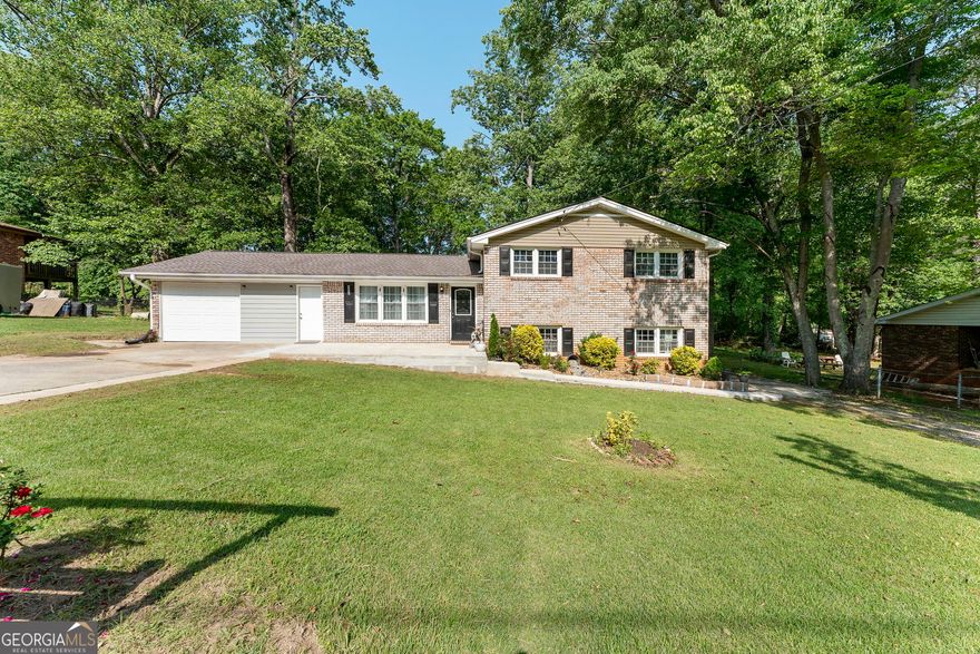 Welcome to 4070 Lauada Drive, a beautiful residence situated in a peaceful, well-established neighborhood in Douglasville's central area. This delightful property offers an ideal combination of comfort, space, and convenience. As you step inside, you'll find a spacious and bright interior that includes a living area enhanced by new flooring. The home also features a well-equipped kitchen with plenty of cabinet space. The bedrooms are generously sized for relaxation, and the master suite includes a private bathroom for added comfort. This home has a new roof and Hot Water Heater for peace of mind.    The expansive backyard provides a new storage shed and a wonderful outdoor space perfect for entertaining, gardening, or simply relaxing. Conveniently located just minutes from schools, shopping, dining, and I-20, this home offers both a serene environment and easy access to amenities. Don't miss this opportunity to make this move-in ready gem your new home!