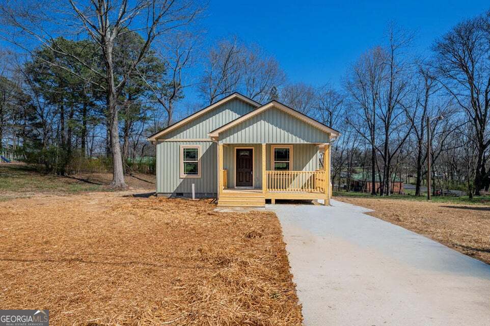 NEW CONSTRUCTION 2 bedroom, 2 bath home on nice level lot convenient to shopping, restaurants, and schools. Living room/kitchen boasts an open floor plan. Exterior offers low-maintenance vinyl siding and two good size covered porches. Additional interior features include LVP flooring throughout, mini split ductless units, good size laundry room off of the side porch entrance and more. Concrete driveway. Seller providing all stainless kitchen appliances.