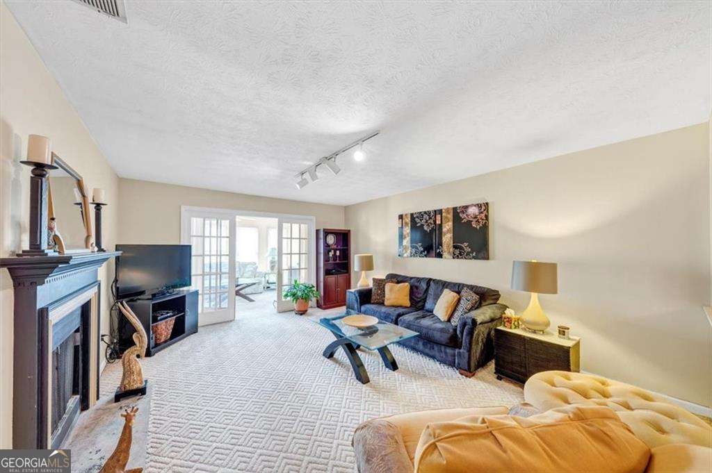 Welcome to this charming 2-bedroom, 2-bathroom condo in the heart of Duluth! This rare one-level unit features a spacious open floor plan with a cozy fireplace in the family room and a dedicated dining areaCoperfect for comfortable living and entertaining. Both bedrooms are generously sized, including an oversized primary suite with two closets and a private bath. Enjoy your covered patio, ideal for relaxing or hosting guests. This home is priced to sell, offering exceptional value in a convenient location. Located just minutes from Gwinnett Place Mall, Downtown Duluth, and a wide variety of shops, restaurants, and parks. You'll love being close to seasonal festivals, concerts, and summer events that bring the community to life. Additionally, the area is experiencing a surge in film and television production, with nearby studios such as OFS Studios and Eagle Rock TV Studios contributing to the local economy . This vibrant atmosphere adds to the appeal of the neighborhood. Community amenities include assigned and guest parking, a swimming pool, and HOA-covered water, sewer, trash, and exterior maintenance. DonCOt miss out on this Duluth gem!