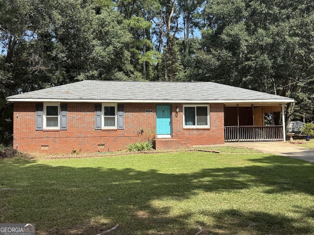 A well built and maintained 4 sided brick home with 2 bedrooms and one bath. Master bedroom is a good size and the secondary room is decent size. Bathroom has a separate shower area. Home has an open floor plan that includes the living room and kitchen. Kitchen has the open cabinet style. Large walk in laundry room which can also be used as a mudroom. Flat yard around home and a large pasture boarding two sides of the property giving the home great privacy. Carport is currently being used as a large relaxing porch area for barbecuing or just hanging out. Home has newer windows and AC unit. Roof is around 6yrs old. Septic tank has just been cleaned. Easy quick access to highway 316 and not far from numerous shops and restaurants.