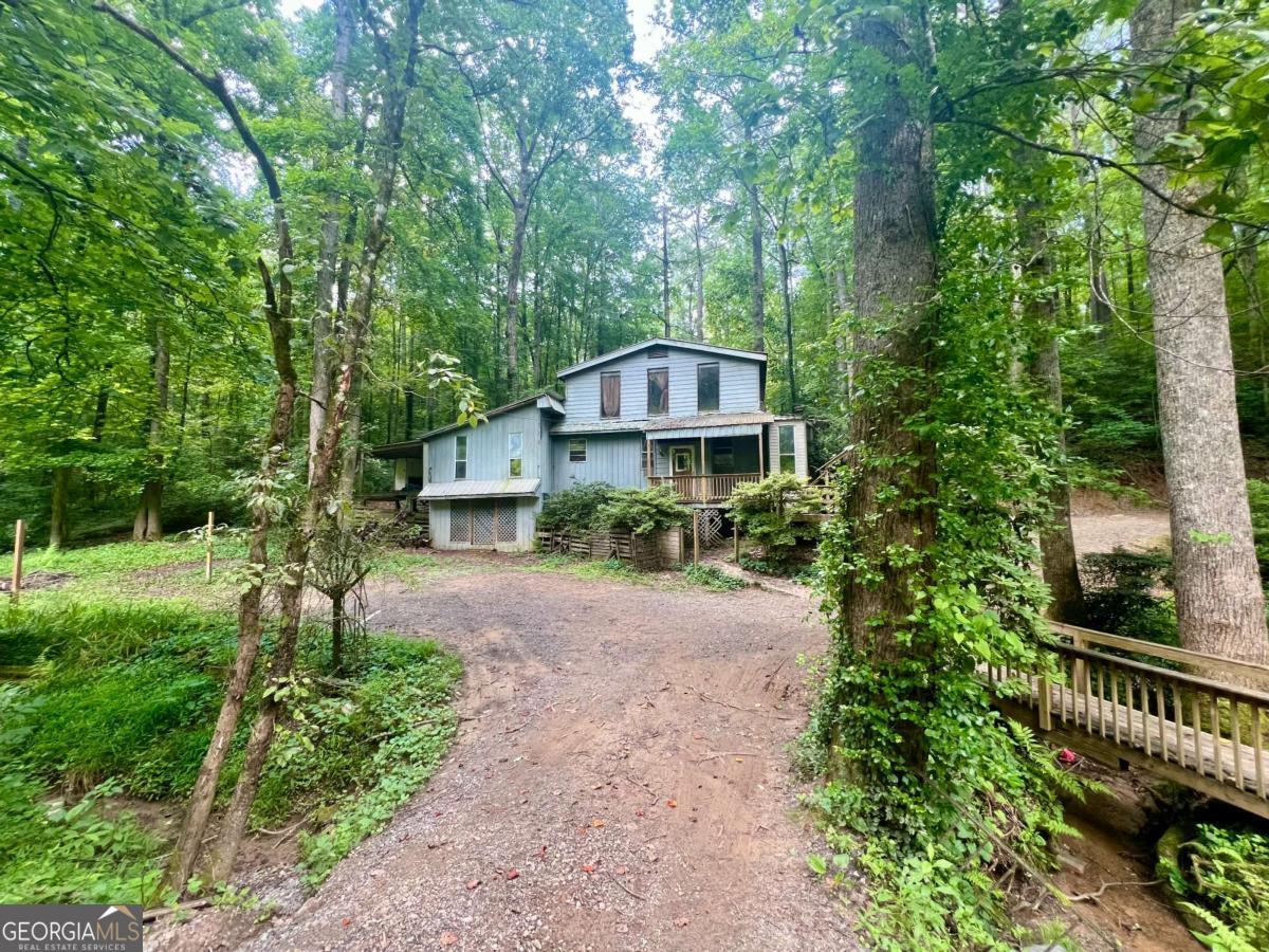 Transform this property into something special. Convenient to beautiful Ellijay and located on 1.92 spacious acres.