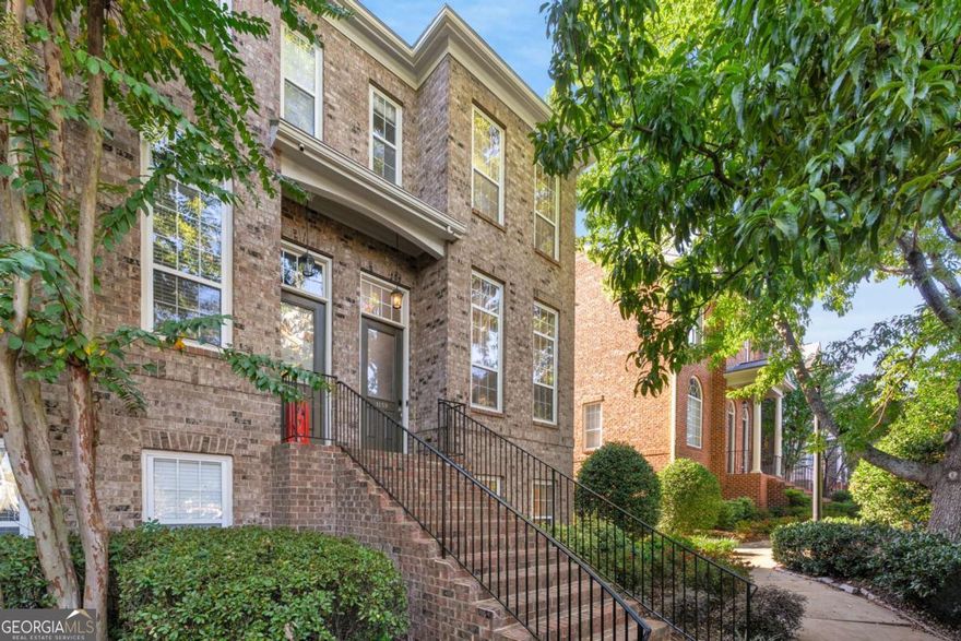 Modern, sophisticated, and full of light, this end-unit brick townhouse offers high ceilings, bespoke fixtures and hardwood floors throughout. Featuring 3 bedrooms and 3.5 baths, the delicious color-drenched formal dining room flows into the fully updated and open kitchen and living room with deck access and a marble-hearth fireplace. The upstairs primary suite impresses with tray ceilings, a custom walk-in closet and relaxing bath featuring a marble shower, tub, and dual vanity. The secondary upstairs bedroom also has its own ensuite bath and a third bedroom or office joins the one-car garage on the lower level.  Enjoy unbeatable walkability, just a 7-minute stroll to Wild Heaven Brewery and Fox Bros. BBQ for craft beer, great food, and live music. Publix, Kroger, and Toco Hills Shopping Center are also nearby, offering local favorites like Salaryman, Silla del Toro, and The Flying Biscuit Cafe. Start your morning with an espresso at Spiller Park Coffee or explore Mason Mill Park, with trails, playgrounds, and tennis courts minutes from your door.  The Toco Hill-Avis G. Williams Library is a short walk away, while downtown Decatur's dining scene, including The Iberian Pig and The Brick Store Pub, is just 10 minutes by car. Film lovers will enjoy quick access to The Tara Theater, and coming soon, Lulah Hills, a vibrant mixed-use destination only 8 minutes away. The DeKalb Farmers Market and the acclaimed Buford Highway restaurants are also just a short drive from home. Plus, the Globe Academy new campus is just across the street!