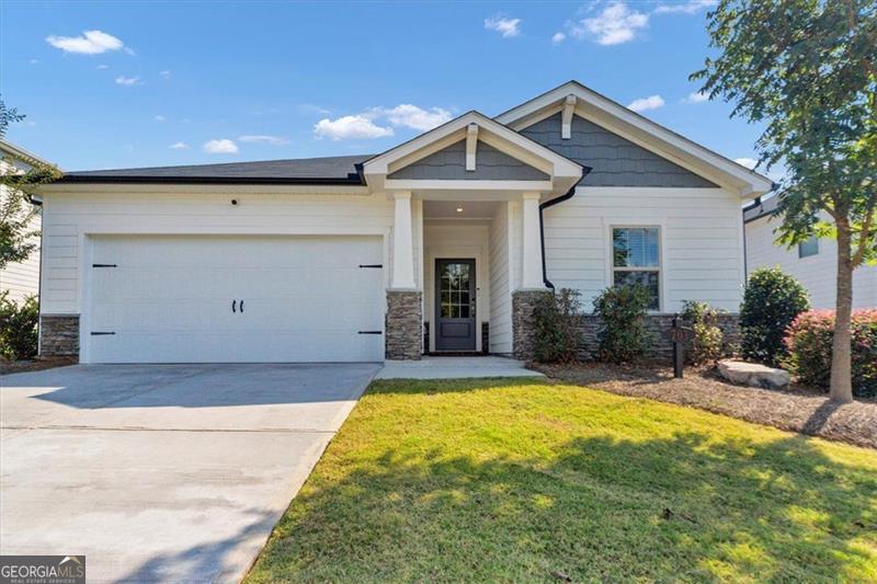 Beautiful Craftsman Home in Prime Location! This stunning 3-year-old Craftsman-style home blends modern efficiency with timeless charm. Featuring 3 bedrooms, 2.5 bathrooms, and an open-concept design, this home is perfect for both entertaining and everyday living. The open, light and bright living space is oh so welcoming! The chef's kitchen boasts a walk-in pantry, an oversized quartz island, and stylish fixtures, flowing seamlessly into the main living space. The luxurious primary suite offers a spa-like walk-in shower and a custom-designed walk-in closet. The Jack-and-Jill bathroom serves the secondary bedrooms for family and/or guests. And, you'll enjoy a bonus room to make into whatever your heart desires - office, living space, playroom, etc. Step outside to enjoy your fenced backyard and private patio, or take advantage of the community amenities including sidewalks, a park, and a swimming pool. Located in a highly sought-after neighborhood, you'll be just minutes from I-575, shopping, dining, vibrant Downtown Woodstock and even Lake Allatoona. Don't miss the opportunity to call this beautiful home yours-it's truly move-in ready and waiting for you!