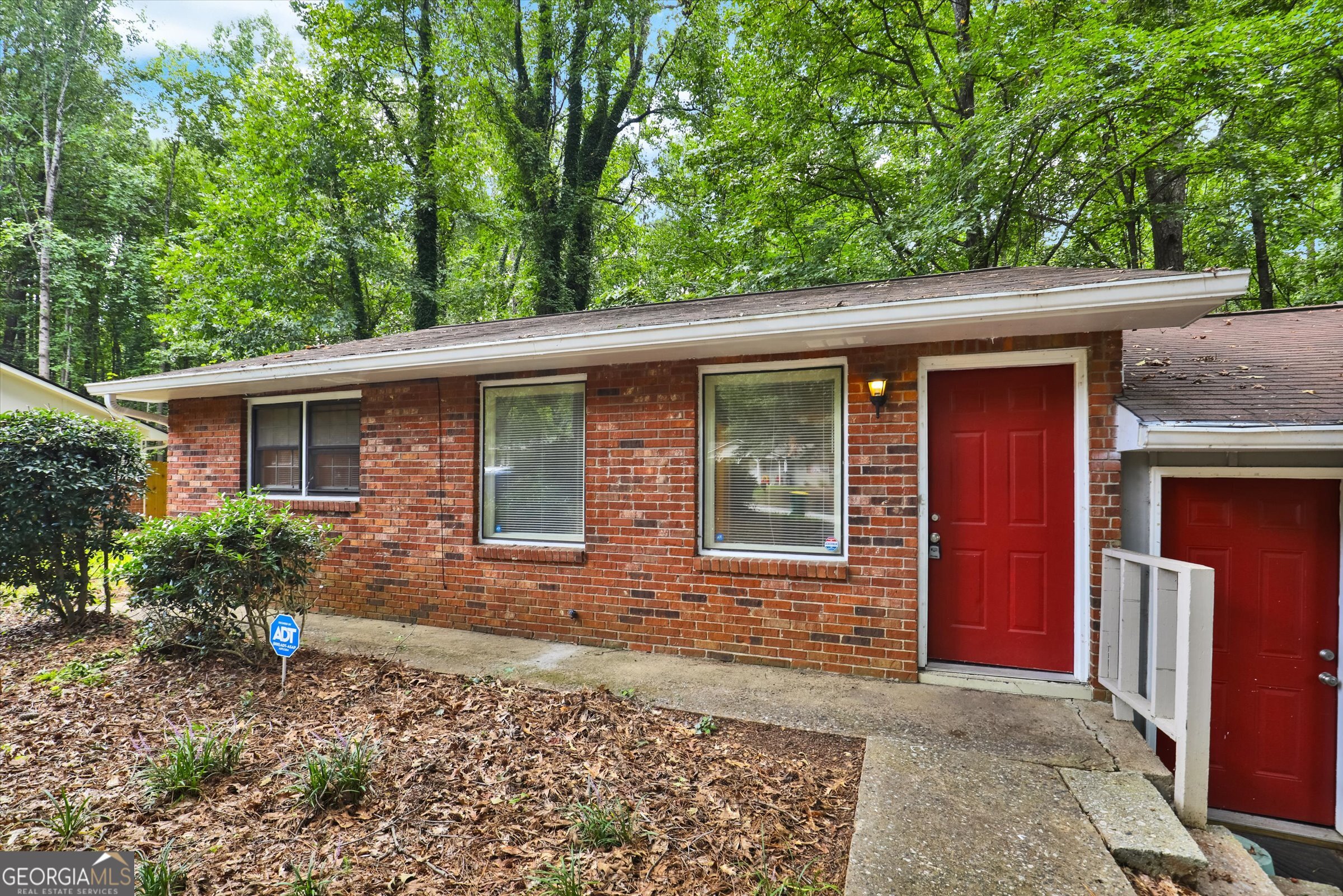 Welcome to 4371 Springwood Terrace, a comfortable 2-bedroom, 1-bathroom single-level home in a peaceful, tree-lined neighborhood. This property is the left side of a duplex-style single-family home, giving you the feel of private living with the benefit of low-maintenance convenience. Inside, you'll find a bright living room with plenty of natural light, a spacious eat-in kitchen with ample cabinet storage, and two well-sized bedrooms. The bathroom connects directly to the primary bedroom and hallway, making it easily accessible for all. A laundry hook-up is included in the ensuite area, adding functionality to everyday living. The neighborhood offers a quiet residential setting while keeping you close to everything you need. Just minutes from Southlake Mall, Home Depot, Walmart, and everyday shopping and dining options, you'll never be far from essentials. Outdoor enthusiasts will appreciate nearby Reeves Creek Trail and Independence Park, while commuters enjoy quick access to I-285, I-75, and I-85. Plus, the home is only about 15 minutes from Hartsfield-Jackson Atlanta International Airport, making travel simple. With its convenient location, single-floor living, and tranquil setting surrounded by trees, this home blends comfort, accessibility, and lifestyle amenities. The property is currently vacant and available to show, ready for its next residents to move in and enjoy.
