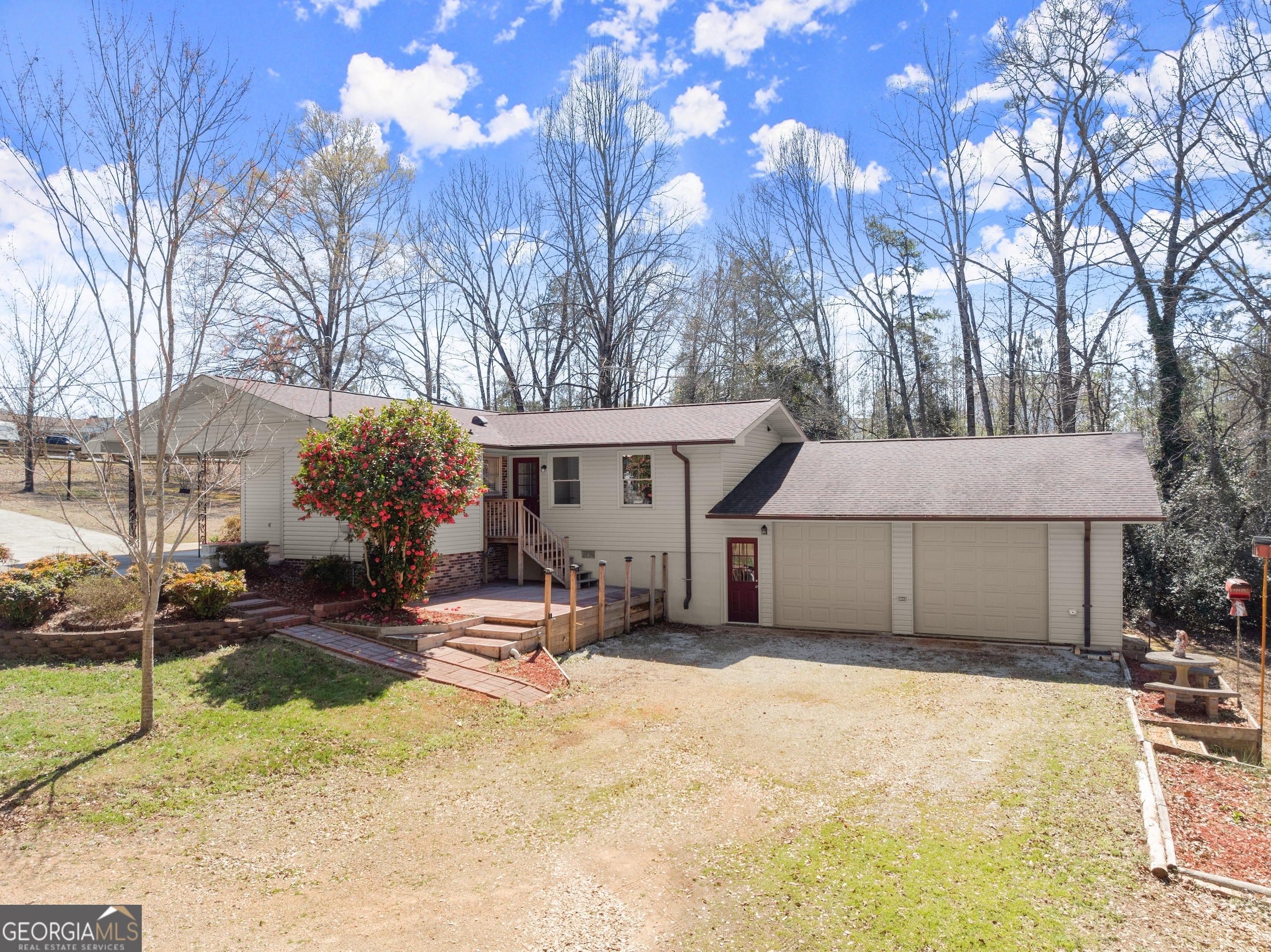 RECENTLY RENOVATED HOME WITH NEW UPGRADED KITCHEN & 30'x40' DETACHED SHOP! Check out this meticulously maintained and updated brick ranch. 4 bedroom floor plan (including 2 primary suites), 3 full baths and 2 half baths property with carport, two-car garage and detached 30'x40' shop. The front entry welcomes into the large living area which spills over into the fully renovated kitchen with shaker style cabinets, island, eat-in dining area, granite counters and stainless steel appliances. Lots of windows allow natural light to course through the space. Large laundry room with storage. Venture down the hall to find large bedrooms, renovated full bath and bedroom with an en suite. Adjacent to the kitchen is an additional large primary suite with fully renovated bath that offers easy access to the large 2 car garage (electric door opener) with bonus half bath (plumbed to accommodate a full bath) and additional hook up for washer/dryer. Head out to the detached building that features another half bath and two garage doors - perfect for a home based business! Additional outbuilding on the property offers even more storage. Architectural shingles, Rheem water heater (50 gallon) and Trane HVAC (dual fuel) unit. This property is well placed on 1.36+/- acres with privacy fence, mature landscaping and plenty of parking. Schedule your private tour today! This is a one of a kind property that is sure to meet your wish list.