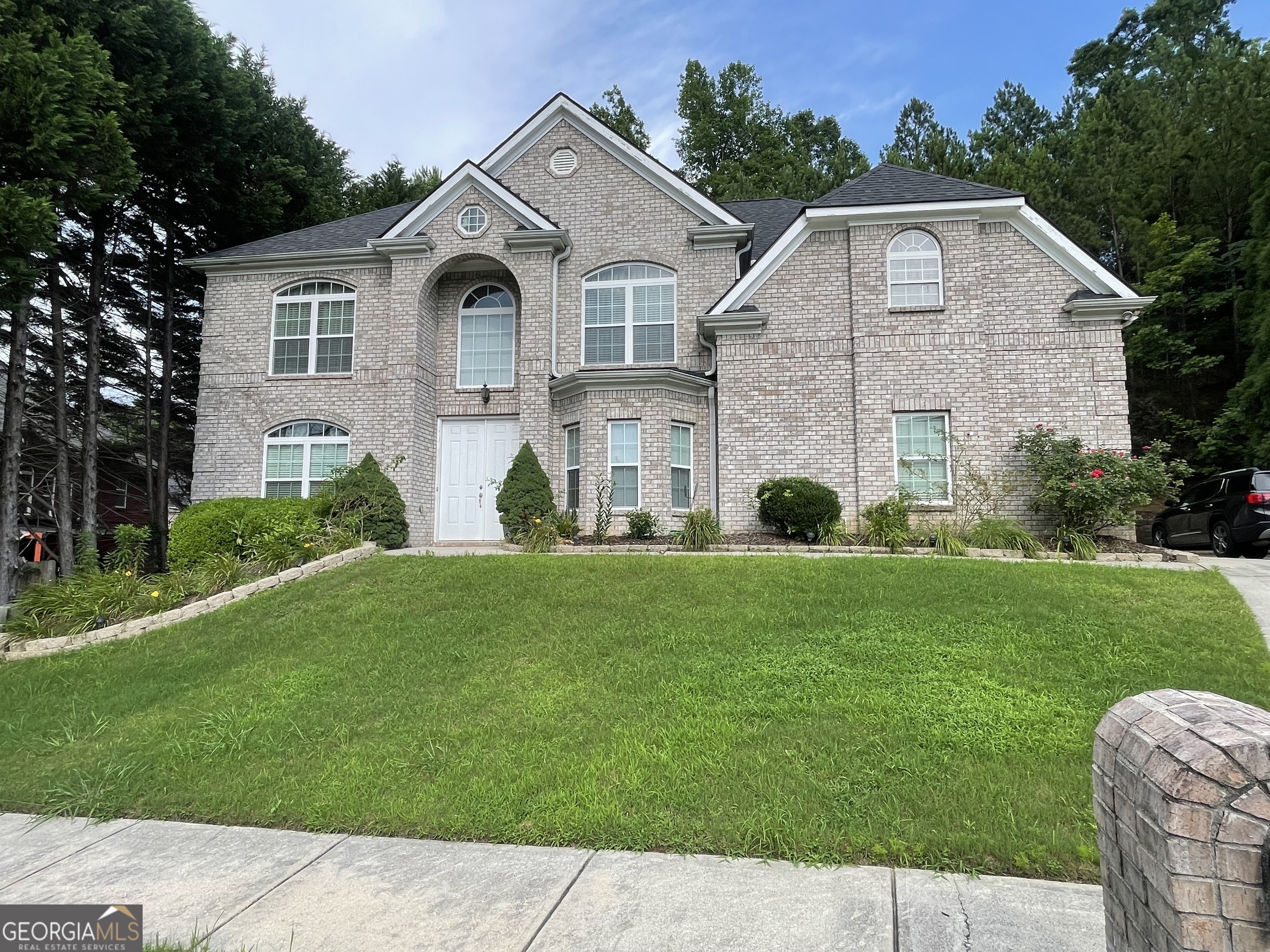 Welcome to Wyncreek Estates. Step into this beautifully maintained 5-bedroom, 3-bathroom home, where comfort meets sophistication. A grand two-story foyer with hardwood floors and crown molding leads into a bright two-story family room, alongside a formal living room and separate dining room. The gourmet eat-in kitchen is a chef's delight, featuring 42-inch cabinetry, stainless steel appliances, and a stylish tiled backsplash. From here, step out to the private fenced backyard and enjoy a cozy patio perfect for relaxing or entertaining, enhanced by an indoor/outdoor intercom system. Upstairs, the oversized master retreat provides a serene escape with its own sitting area, a luxurious master bath, and a spacious walk-in closet. Practical updates include a newer roof, washer and dryer, and upgraded commodes in two bathrooms. A large side-entry two-car garage completes this exceptional home.