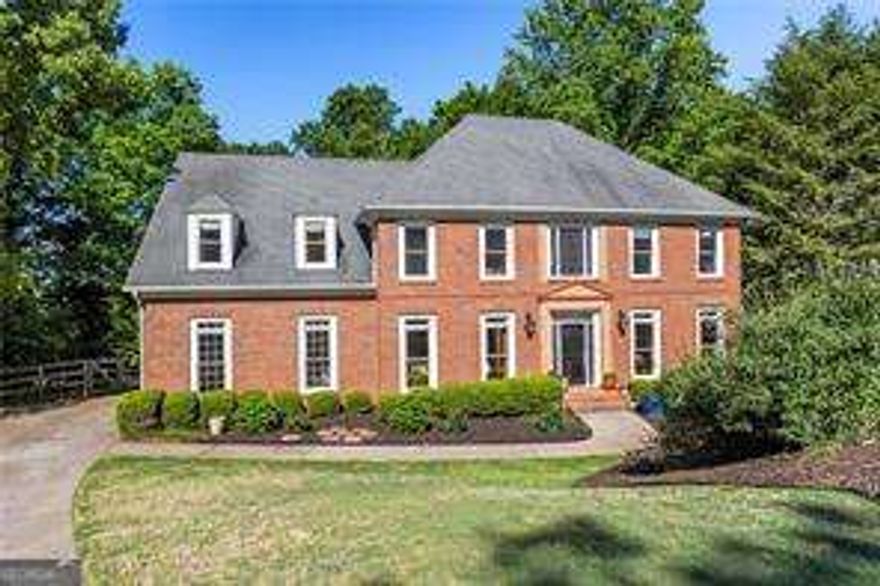 Located in the highly coveted Chartwell neighborhood, this meticulously maintained cul-de-sac home offers timeless elegance and unmatched functionality. Featuring 6 bedrooms and 5 bathrooms, this 3.5-sided brick home sits on a beautifully landscaped lot with mature trees and curb appeal that welcomes you home.    From the moment you enter the 2-story foyer with ample natural light and refinished real hardwood floors, the home impresses with its spacious layout and attention to detail. A formal dining room and a main-level bedroom with full bath flank the entry, ideal for guests or a private office.    The two-story family room boasts impressively high ceilings and a stunning floor-to-ceiling stacked stone fireplace, flowing effortlessly onto a covered deck.    The chefCOs kitchen is equipped with granite countertops, center island seating, updated stainless steel appliances, double ovens, and a gas cooktopCoperfect for both daily living and entertaining. The fireside keeping room creates a warm, inviting space, while the adjacent pantry/laundry room offers generous storage.    Upstairs, youCOll find three secondary bedroomsCotwo sharing a Jack & Jill bath, and one with an en-suiteCoplus a flexible loft area ideal for a den, office, or playroom. The primary suite is a true retreat with a deep tray ceiling, private access to the upper-level covered deck, an expansive dual-entry walk-in closet, and a spa-like en-suite bath.    The full finished basement extends the living space with high ceilings, a complete apartment including a kitchenette, bedroom, full bath, large living area with fireplace, a multipurpose craft room, and two unfinished storage rooms. Step outside to the covered patio and custom fire pit areaCoperfect for cozy gatherings year-round.    Enjoy three levels of covered outdoor living, providing an abundant space for entertaining or relaxing.    An extraordinary bonus: this home has direct access to Newtown ParkCoaccessible without leaving the neighborhoodCooffering an award-winning dog park, amphitheater, sports fields, walking trails, and more.    Chartwell residents also enjoy top-tier amenities including a pool, playground, clubhouse, tennis and pickleball courts, and sidewalks.    This home truly offers the best of Southern charm, modern comfort, and unbeatable location.