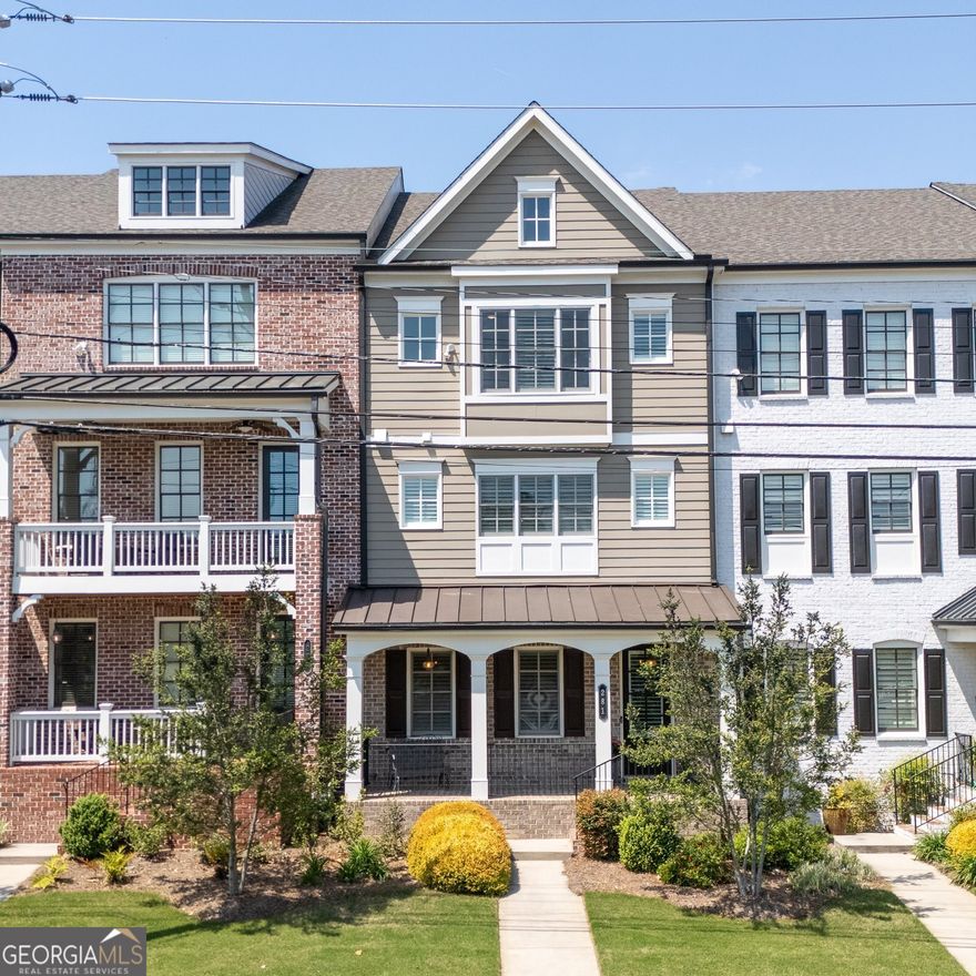 Welcome to this beautifully maintained, newer construction townhouse located just steps from the vibrant heart of downtown Marietta. Blending modern design with timeless charm, this home offers an open-concept floor plan perfect for everyday living and effortless entertaining. The main level features soaring 10-foot ceilings, gleaming hardwood floors, and a spacious living room complete with custom built-ins and a cozy fireplace. The chef's kitchen is a true centerpiece, boasting crisp white cabinetry, stunning quartz countertops, and a large island that flows seamlessly into the dining and living areas. Just off the main floor, enjoy a covered back patio-perfect for morning coffee or evening relaxation. Upstairs, retreat to the serene primary suite featuring a spa-inspired bathroom with a soaking tub, tiled walk-in shower, and double vanity. A generous second bedroom provides additional space for family, guests, or a home office. The fully finished basement includes a third bedroom and full bath-ideal for guests or a private office-plus walk-out access to a covered front porch. Home has a build out for potential elevator.   Located in a sought-after neighborhood with its own dog park, this home offers unbeatable walkability to coffee shops, restaurants, boutiques, and bars throughout the Marietta Square. Don't miss the opportunity to live in one of Cobb County's most desirable historic areas with all the conveniences of modern living.