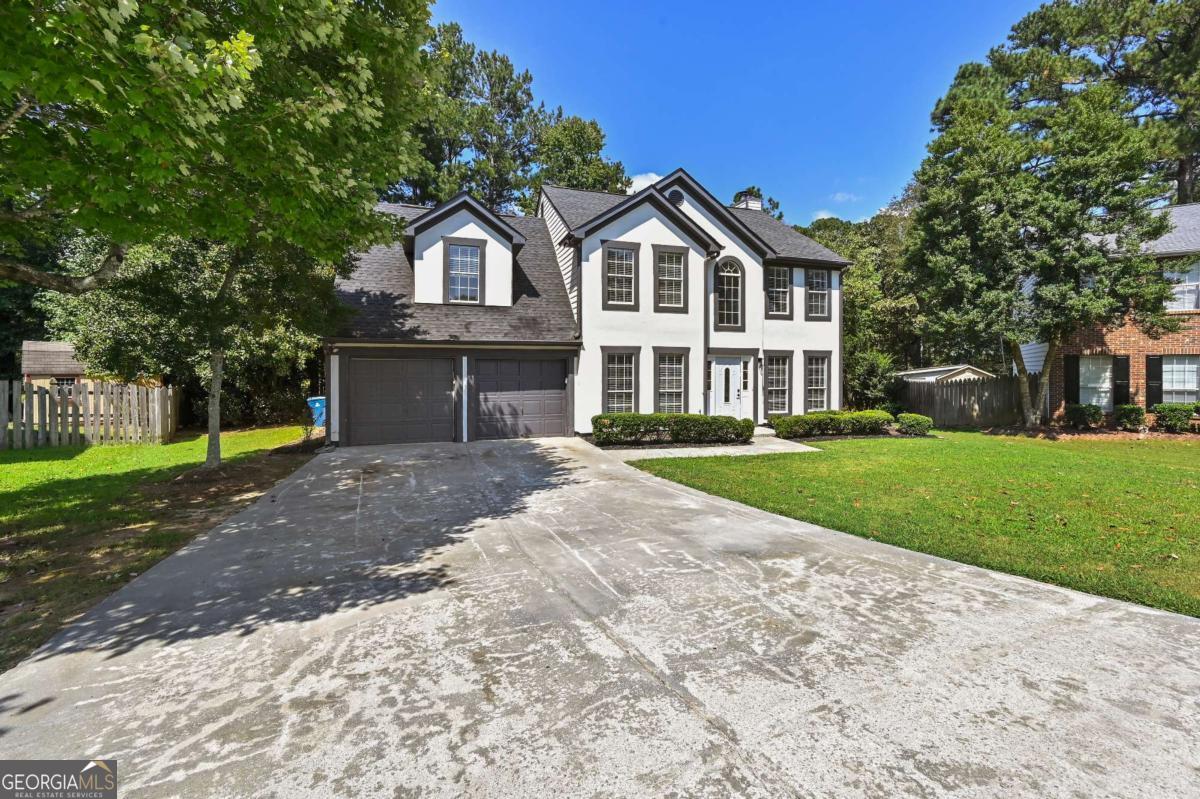 Welcome to 1197 Adah Court - A Home of Distinction in the Sought-After Hadaway Community. Step into timeless elegance and modern comfort in this pristinely renovated four-bedroom, three-and-a-half-bath masterpiece offering over 2,700 square feet of luxury living. Nestled in the prestigious Hadaway neighborhood, this residence captures the perfect balance of style, comfort, and convenience-designed to meet the needs of today's discerning buyer. From the moment you arrive, the eye-catching curb appeal sets the stage. A welcoming exterior and manicured landscape invite you inside, where an outpouring of natural light instantly embraces you. Gleaming floors flow effortlessly through the open layout, leading your gaze to the exquisite staircase and magnificent chandelier, both making a striking statement in the grand foyer.To the right, the spacious sitting room or private office provides an ideal retreat for remote work or quiet reflection, while the elegant formal dining room on the opposite side offers the perfect setting for hosting gatherings and memorable dinners.The heart of the home unfolds in the chef-inspired kitchen, showcasing granite countertops, designer cabinetry, and a generously sized breakfast area that opens seamlessly to walls of windows. From here, enjoy serene views of the peaceful backyard oasis-complete with an enchanting pergola that beckons for morning coffee, weekend barbecues, or twilight conversations under the stars.Flowing from the kitchen is the grand family room, a true showstopper. Adorned with modern color palettes, a captivating statement fireplace, and soaring ceilings, this space radiates warmth and sophistication while offering a perfect vantage point to the second-level overlook.Upstairs, retreat to your private sanctuary-the expansive primary suite. A decorative tiered ceiling, cozy sitting area, and romantic double-sided fireplace create an atmosphere of pure relaxation. The spa-inspired en suite bathroom elevates daily living with its stunning oversized tile, double vanity, separate shower, enormous garden tub, and private water closet.The second level continues to impress with a spacious landing overlooking the foyer and family room, additional oversized bedrooms, abundant closet space, and a guest suite with its own en suite bath. Whether hosting guests, raising a family, or creating personalized spaces, this floor plan offers flexibility and comfort for every lifestyle.Beyond the walls of this exquisite home, the Hadaway community provides unmatched convenience. Located near I-85 and I-285, commuting is effortless, while nearby treasures like Hogan Lake, the Apalachee River, scenic trails, and abundant recreational spaces invite outdoor adventure. For dining, shopping, and entertainment, you are only minutes away from some of the area's most popular destinations.This is more than just a home-it's an experience. A place where timeless elegance meets modern convenience, where every detail has been carefully designed for comfort and style, and where you can truly envision your future. Schedule your private showing today through ShowingTime and discover all this stunning property has to offer.