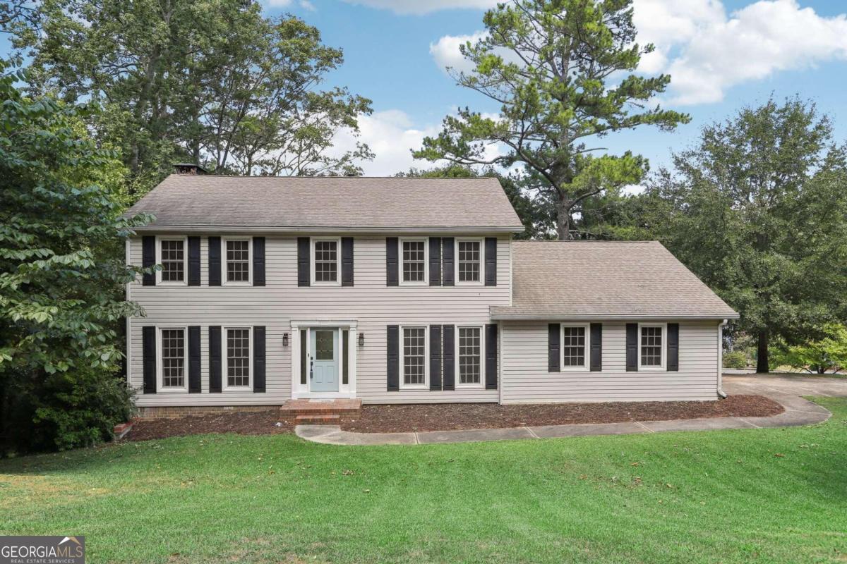 Beautifully updated Colonial with lots of charm and bright, open spaces! Step inside to beautiful hardwood floors in the entry foyer with a spacious formal living room to the left, perfect for home office or media room. Wow your guests with a formal dining room to the right featuring hardwood floors, updated light fixture, and gorgeous accent wall. Family room has lots of natural light, built-ins, and a stone fireplace with easy access to the back deck with private wooded views. Enjoy a beautifully updated kitchen featuring granite counters, subway tile backsplash, stainless steel appliances, new cabinets, soft close drawers, and a bright breakfast room! A large laundry/mud room with a tub, perfect for dogs/quick clean-ups, as well as an updated half bath complete the main level. All bedrooms upstairs for added convenience. Retreat to the primary suite with a walk-in closet and an updated en-suite bath with a marble tiled shower. Three spacious secondary bedrooms all have ample closets with an updated full bath nearby! Partially finished daylight basement is ready to transform into your dream space - man cave, craft room, playroom, you name it! Don't miss the huge private backyard with mature trees, upstairs deck with new stairs, and downstairs covered patio area. A walk-in crawl space, new garage door, and new insulation in attic are among the many updates this home offers. Located near shopping, dining, and easy highway access and with NO HOA, this home won't last long!