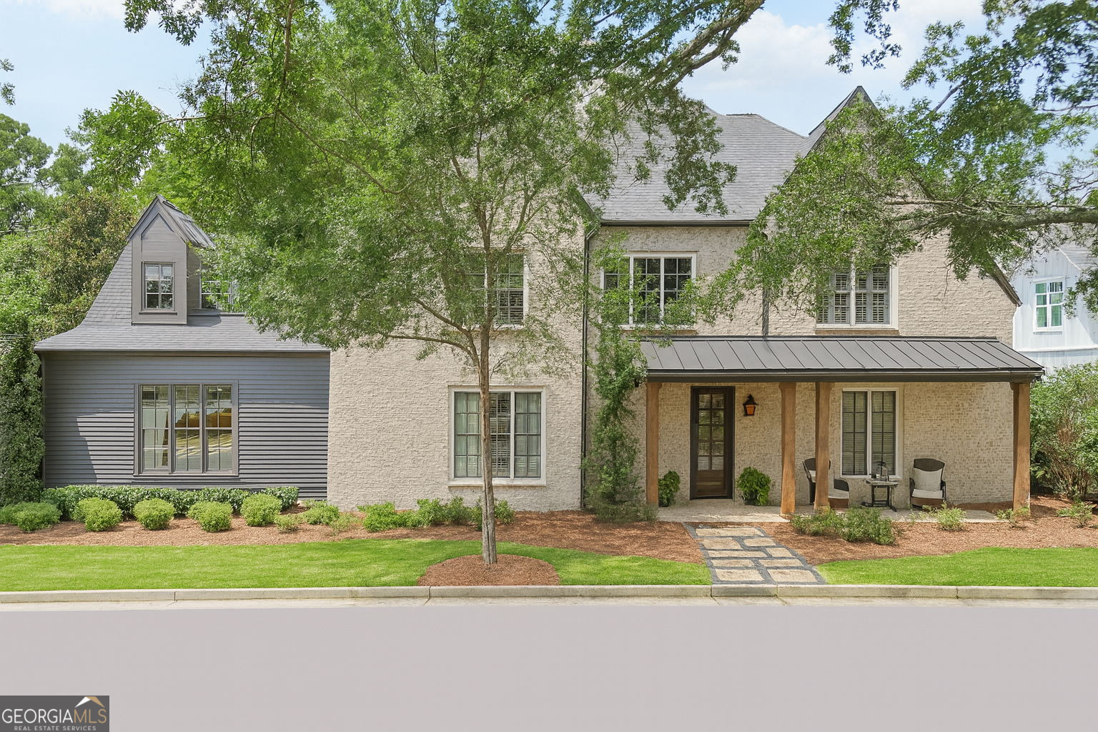 **JUST REDUCED FOR QUICK SALE!!**Nestled in one of East Cobb's most desirable communities, this exquisite residence offers timeless elegance and modern functionality, all centered around a picturesque park anchored by a majestic 100-year-old oak tree and a charming rustic pavilion. From the moment you step inside this home, soaring 10-foot ceilings, rich white oak hardwood floors, intricate crown molding, and abundant natural light streaming through plantation shutters create a warm yet refined welcome. Designed for effortless entertaining, the open concept living area features a brick gas-starter fireplace and flows seamlessly into the gourmet kitchen, where a massive 9.5-foot island with extra cabinetry, high-end KitchenAid appliances, and a Scotsman pebble ice maker cater to the most discerning chef. The spacious walk-in pantry is appointed with custom wooden shelving that adds a touch of craftsmanship while providing ample, well-organized storage for your culinary essentials. Just off the kitchen, a private home office offers a quiet, light-filled retreat-perfect for working from home, managing household tasks, or serving as a stylish study-with space to accommodate built-ins or custom furnishings. The main-level primary suite is a private retreat, complemented by a spa-inspired bath with a frameless walk-in shower, soaking tub, dual granite vanities, upgraded 36-inch soft-close cabinets, and a custom walk-in closet complete with designer built-ins, soft-close drawers, and specialized jewelry storage. A dedicated stacked washer and dryer in the primary bath adds unmatched convenience. Upstairs, five generously sized bedrooms provide abundant closet space-one with its own ensuite bath, two connected by a Jack-and-Jill, and the rest served by another full bath. An alcove offers the perfect reading nook, and a large laundry room enhances functionality. A full staircase leads directly to the attic, offering easy access to generous additional storage. The home's effortless indoor-outdoor connection transforms the backyard into an entertainer's haven. From both the great room and the primary suite, step directly onto the expansive deck and into a private, fully fenced retreat designed for hosting in style-complete with a custom-built pergola framing a second fireplace for gatherings, a Hot Spring hot tub with a brand-new cover for year-round enjoyment, and a pre-installed gas line ready for creating the ultimate outdoor kitchen. The lot extends beyond the current fence line expanding the outdoor living. Additional features include two HVAC units with humidifier, a central vac system, irrigation system, tankless water heater, and IQ panel security system. The Oaks at Mill Pond is a boutique community of 25 custom built homes. The HOA maintains the lawn, ensuring a well-kept exterior with minimal effort for the homeowner. Ideally located within walking distance to the highly acclaimed Lassiter High School, this home offers quick access to premier shopping at The Avenue East Cobb and Merchants Walk, as well as popular trails and green spaces like Sweat Mountain Park and Noonday Creek Trail. With easy connectivity to I-75 and I-575, it provides both luxury and convenience in an unbeatable location.