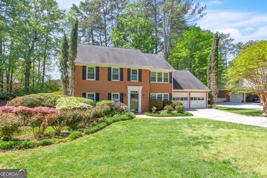 HANDSOME EAST COBB HOME in highly sought-after community, Princeton Mill! This stately 3 sided brick residence is tucked away on a mature tree-lined street, yet close to everything East Cobb has to offer! With hardwoods on the main, NEW carpet on the second floor, and all NEW interior paint- this home is ready for a new owner to add their own personal touches. Featuring a classic formal dining roomCoperfect for entertaining or relaxing in style, and a formal living room which can double as an office/ flex space. The neutral eat-in kitchen with granite countertops is bathed in natural light from large UPDATED windows. Indulge in your morning coffee while sitting in the All-Season back porch- with beautifully landscaped gardens and lively birds just outside the window! Walking paths throughout the manicured gardens offer private tranquility, plus are an easy low-maintenance backyard. Summer is just around the corner! Enjoy the large back deck with built-in seating along the perimeter. Head back into the den with handsome built-ins and a wet bar, accented by a cozy fireplace plus hallway access to the powder room. Upstairs, the spacious ownerCOs suite features a deep tray ceiling with dual closets and an ensuite bathroom. 4 generous secondary bedrooms provide ample storage space plus a convenient rear staircase down to the kitchen & laundry room. Princeton Mill is a popular swim/tennis neighborhood and is in the desirable Eastvalley Elementary school and Wheeler Magnet HS District with acclaimed STEM program! HOA offers a swimming pool with seasonal lifeguards, two tennis courts, social events year-round including an annual Spring Egg Hunt, plus active swim & tennis teams. Easy access to Hwy 120 and I-75, Home Depot, Whole Foods, the shops at Merchants Walk and the Avenue.