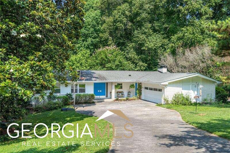 Spacious 1961 Mid-Century Modern ranch located in beautiful Echo Woods of Oak Grove. From the moment you enter the double front door, you will discover traditional elements that make Mid-Century Modern homes so desirable : over-sized entry foyer, floor-to-ceiling windows, original hardwood floors, lush forest views and more! This home has wonderful public spaces with formal living room, formal dining room, over-sized eat-in kitchen (with keeping room), light-filled den, and finished terrace level...perfect for media, game, or play room. The master suite and secondary bedrooms are nicely secluded from the entertaining spaces, while the separate bedroom and bath located on the terrace level is great for a guest or teen suite. Lots of care and attention have gone into preparing this home for the next owners : new HVAC, new water heater, new terrace level carpet, exterior renovation with designer paint colors, completely new deck, and more! It is always sad to say farewell to such a treasured and loved home, but we've prepared this residence for another family to come and write the next chapter of of their own happy memories. Gorgeous, private lot, including many treasured specimen plantings and mature hardwoods, adds to the beautiful setting of this home. Terrific location with easy access to Emory, the CDC, the new CHOA Campus, Downtown, Midtown, Buckhead and more! Don't miss out. Check out the photos and schedule a showing before it's gone. Seller believes the Dekalb Count Tax Records do not adequately reflect the square footage of the home.