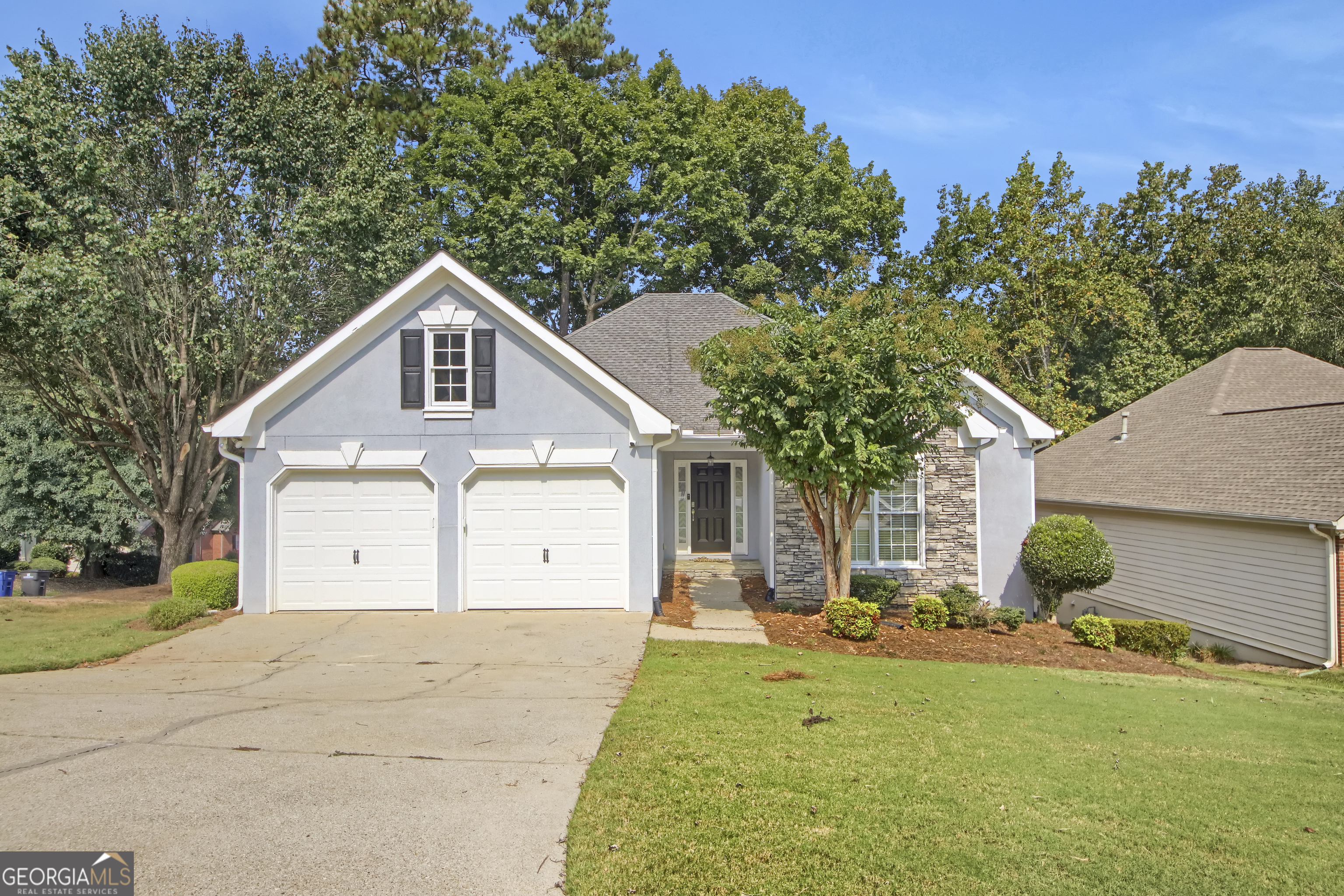Welcome to 3439 Emily Place, a beautifully maintained home in the heart of Douglasville's sough after Chapel Hills Golf Course Community! This property offers a unique blend of comfort, functionality, and versatility-ideal for those looking for a true multigenerational living arrangement. This corner lot home has so much to offer! The main level boasts an inviting floor plan with a bright living room, well-appointed kitchen, and generously sized bedrooms. Downstairs, you'll find a fully finished basement that's essentially its own living space-featuring 2 large bedrooms, a full bathroom, a complete kitchen, laundry and even its own 1-car garage. Whether you need space for in-laws, extended family, or a private guest suite, this setup provides endless possibilities! Enjoy outdoor living with a private backyard featuring a brand new $20K+ Ben Hill Deck, perfect for gatherings or quiet evenings. Conveniently located near shopping, dining, schools, and major highways, this home balances suburban comfort with easy access to everything you need. Don't miss this rare opportunity to own a home designed with flexibility in mind. Schedule your tour today! Seller is extremely motivated, buyer paid closing cost is possible.