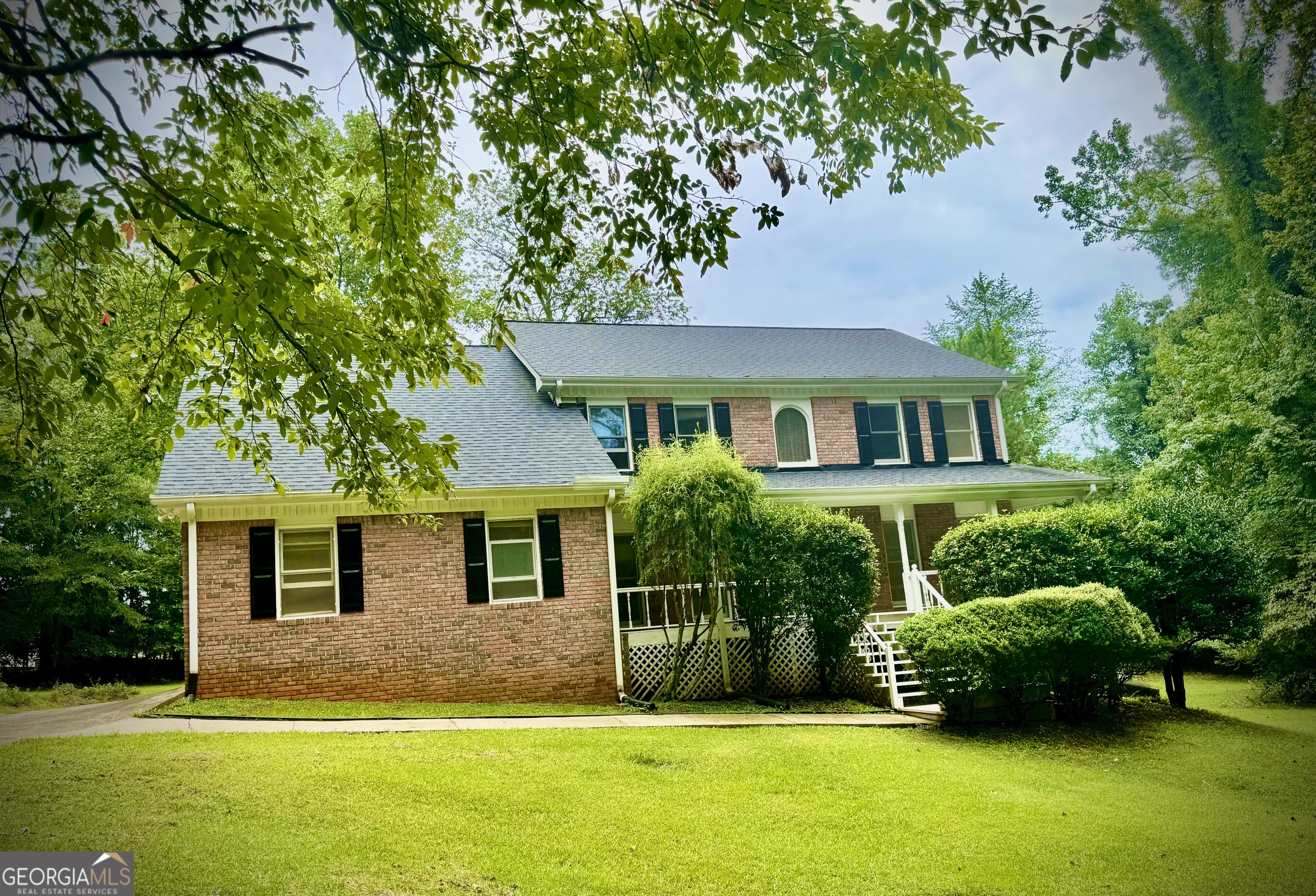 Executive Living at an Entry-Level Price! This beautiful, solidly-built custom home is a must-see, peacefully situated on a quiet cul-de-sac in one of Conyers' most desirable neighborhoods. With 4 spacious bedrooms, 4 full bathrooms, a versatile bonus room, and a large basement featuring its own full bathroom and separate entrance, this home offers endless possibilities for families, guests, or even rental income. Inside, you'll love the warm and inviting family room featuring a cozy fireplace and an elegant staircase leading upstairs. The formal living and dining rooms are perfect for hosting, while the bright and open eat-in kitchen makes everyday dining a pleasure. BUT WAIT... THERES MORE! Step outside onto the charming covered front porch or relax or the expansive patio deck overlooking your flat, usable backyard-perfect for gardening, entertaining, children's play area, or even your future pool. With a long driveway providing ample parking and a convenient attached garage, coming home has never been easier. ALSO... the owner states the lot can potentially be subdivided, allowing for another home to be built-perfect for a home for the inlaws, a guest house, an investment, or to increase future value. Enjoy easy access to Highways 212, 138/20, and Interstate 20, putting shopping, restaurants, entertainment, and top-rated schools just moments away. Welcome home to this vibrant community-make this incredible opportunity yours today!