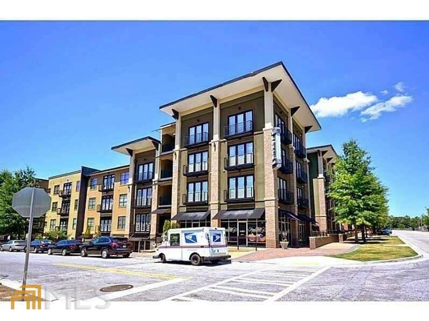 FANTASTIC LOFT, 2 BR CLAIRMONT FLOOR PLAN, ON TOP (4TH) FLOOR! KITCHEN WITH GRANITE COUNTERTOPS & STAINLESS STEEL APPLIANCES, REFRIGERATOR, WASHER & DRYER TO REMAIN. FABULOUS AMENITIES CONSIST OF: POOL, COVERED PARKING, MODERN FITNESS CENTER, ROOFTOP DECK WITH TENNIS COURTS, CAFE WITH BILLIARDS TABLE, 3 LUCH INTERIOR COURTYARDS WITH WATER FEATURES, ONSITE MANAGEMENT COMPANY. ACROSS THE STREET FROM MARTA. 2 ASSIGNED PARKING SPACES (1 COVERED, 1 UNCOVERED). UNIT HAS BEEN PAINTED WITH AGREEABLE GRAY.