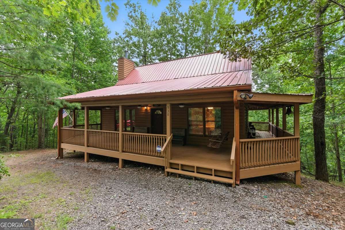 True Log Cabin with Long-Range Mountain Views in Talking Rock Creek Resort Welcome to your mountain escape! This authentic log cabin in the gated Talking Rock Creek Resort offers stunning, long-range mountain views and the rustic charm you've been dreaming of. Featuring a spacious loft, cozy wood-burning stove, and a partially finished basement, this cabin is perfect as a full-time home, weekend getaway, or short-term rental investment. The inviting wrap-around porch is ideal for soaking in panoramic views, sipping your morning coffee, or watching the sunset over the ridges. Additional highlights include: *Warm, wood interior with true log construction *Open-concept living area with vaulted ceilings *Basement space ready for expansion, recreation, or guest quarters *Easy access to the main gate and resort amenities, including pools, tennis courts, private lake, and hiking trails Whether you're seeking serenity, adventure, or both, this cabin delivers it all. Unmatched views, a prime location, and true log home character-this is mountain living at its best. Don't miss your chance to own a piece of North Georgia paradise!
