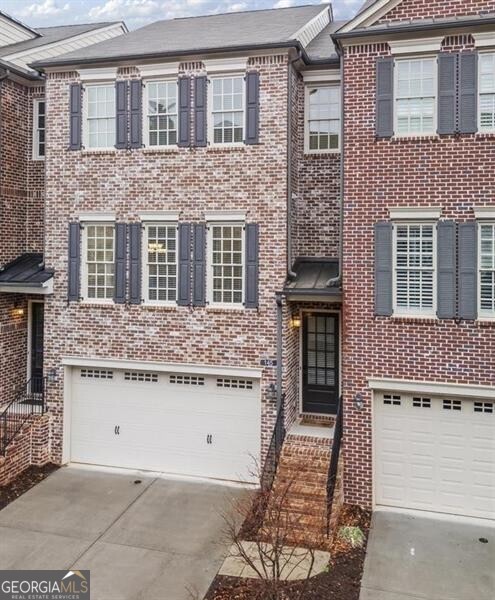 Discover this stunning townhome in The Georgian perfectly situated in the vibrant heart of Alpharetta, GA. Enjoy open concept living with a spacious island Kitchen featuring Granite Counter Tops, Stainless Steel oven, warming drawer, 5 burning gas cooktop, refrigerator, dishwasher and large pantry. Charming Dining Room and Fireside Great Room with niches providing more room for your d cor plus a private half bath. Hardwood flooring throughout the main level and new carpet in all the bedrooms. Luxurious Owners Suite enjoys a large tile bathroom with soaking tub, large corner shower, granite double vanity plus an enormous walk-in closet. The guest suite enjoys another large walk-in closet plus a private tile bathroom. On the terrace level is a large guest suite or recreation room plus a private tile bath and walk in closet. This townhome features two decks overlooking private common area, the lower deck walks out to rear yard. Spacious two car garage. Easy Living in The Georgian, hassle-free lifestyle with the HOA maintaining the exterior will allow freedom to enjoy Awesome Alpharetta with all the restaurants, shopping, Alpha Loop, the Farmer's Market and so much more!