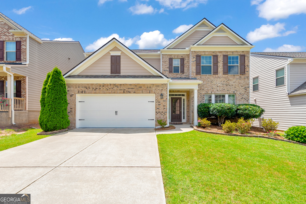Welcome home to this spacious 4 bedroom, 3 bathroom East-facing gem in the desirable Waterbrooke community! Recent upgrades include a new roof, appliances, carpet, and fresh interior and exterior paint! A welcoming foyer greets you upon entry, with a formal dining room to the right-perfect for entertaining. The fireside family room flows effortlessly into the kitchen, featuring stone countertops, a breakfast bar, a walk-in pantry, and a sunny breakfast room. A convenient main level bedroom and full bathroom are ideal for guests or multigenerational living. Upstairs, you'll find a large bonus room that can serve as a home office, playroom, or flex space. The oversized primary suite is a true retreat with tray ceilings, a spa-like ensuite bathroom with dual vanities, a soaking tub, separate shower, a massive walk-in closet, and access to a private covered deck overlooking the backyard. Two additional bedrooms share a full bath, and the laundry room is conveniently located on the upper level. Enjoy outdoor living on the covered patio overlooking the spacious, fenced-in backyard. Additional features include an attached 2-car garage and access to amazing community amenities: pool, playground, tennis courts, and clubhouse. Located in the top-rated Denmark High School district with easy access to Downtown Alpharetta, Halcyon, Fowler Park, major roadways, and an abundance of shopping and dining options-this home truly has it all!