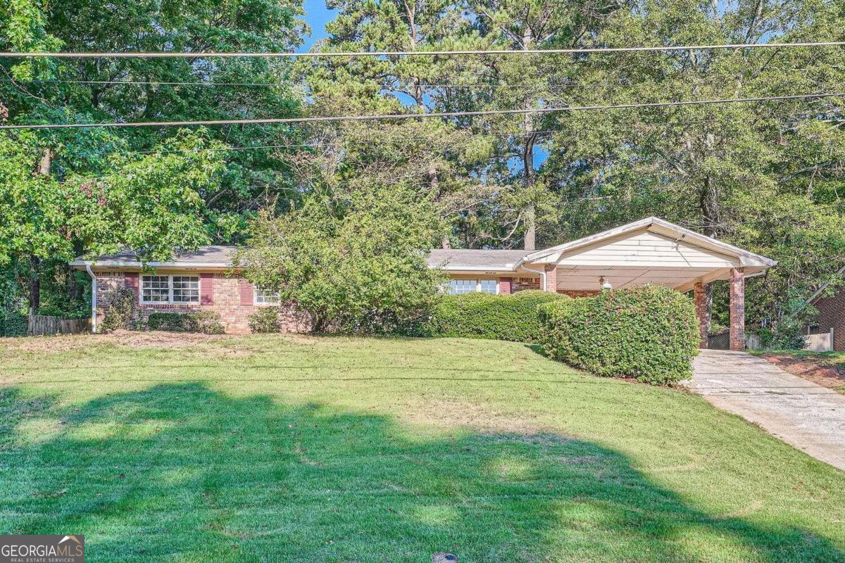 Welcome to this 3-bed, 2-bath brick ranch, located in Decatur, GA. This cute fixer home perfectly blends charm and modern convenience. Step inside to discover a foyer that leads to a spacious and open living area, enhanced by high ceilings and large windows that fill the space with natural light. The primary suite offers a generous layout, a walk-in closet, and an en-suite bathroom. This property needs cosmetic work  - investors and buyers come to visit it and make it your own! The property is located in a friendly neighborhood with easy access to local schools, parks, shopping, and dining.  Schedule a showing today!