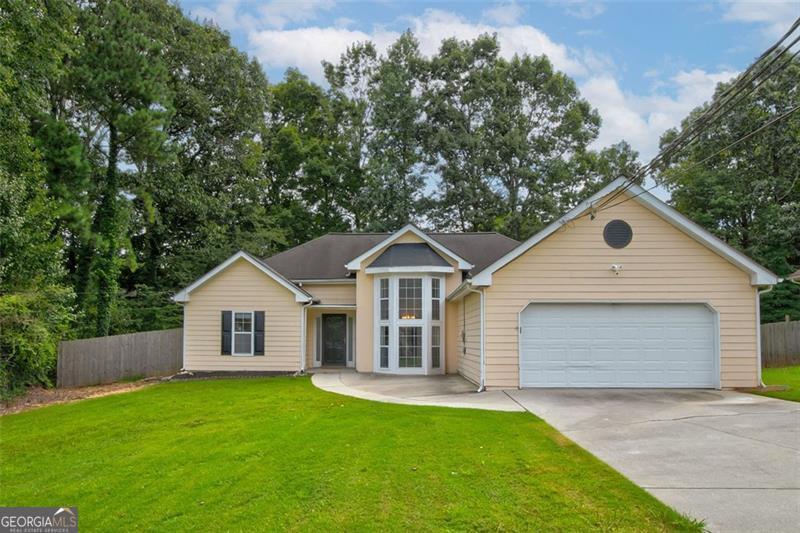 Welcome home to 84 Oxford Brook Way, a beautifully maintained 3-bedroom, 2-bath home in a peaceful Lawrenceville neighborhood. Recent upgrades include fresh interior paint, updated landscaping, and repaired siding on all four sides, ensuring lasting curb appeal. Inside, enjoy beautiful flooring less than two years old, a bright kitchen with classic white cabinetry, and new stainless-steel appliances. The formal dining room and breakfast nook offer flexible spaces that can easily serve as a home office, playroom, or additional lounge area. A spacious 2-car garage and covered rear patio add to the home's comfort and functionality. Previously tenant-occupied, this property also presents a great opportunity for investors seeking a desirable rental. Warm, welcoming, and move-in ready-this home checks all the boxes. Note: Floorplan sqft incorrect.