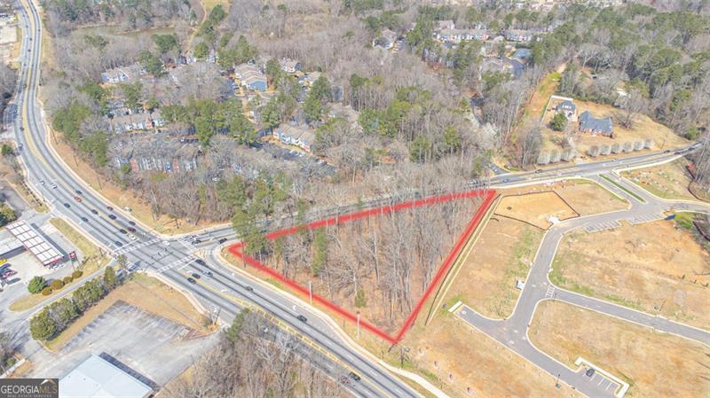 Prime commercial development opportunity on Covington Highway in DeKalb County. This 1.81-acre site consists of two parcels being sold together: 5646 Covington Hwy (Parcel ID: 16 006 03 001) and 5650 Covington Hwy (Parcel ID: 16 007 02 013). Located in the Greater Hidden Hills Overlay (Tier 1), the property is ideally positioned at the signalized intersection of Covington Hwy and Young Rd.