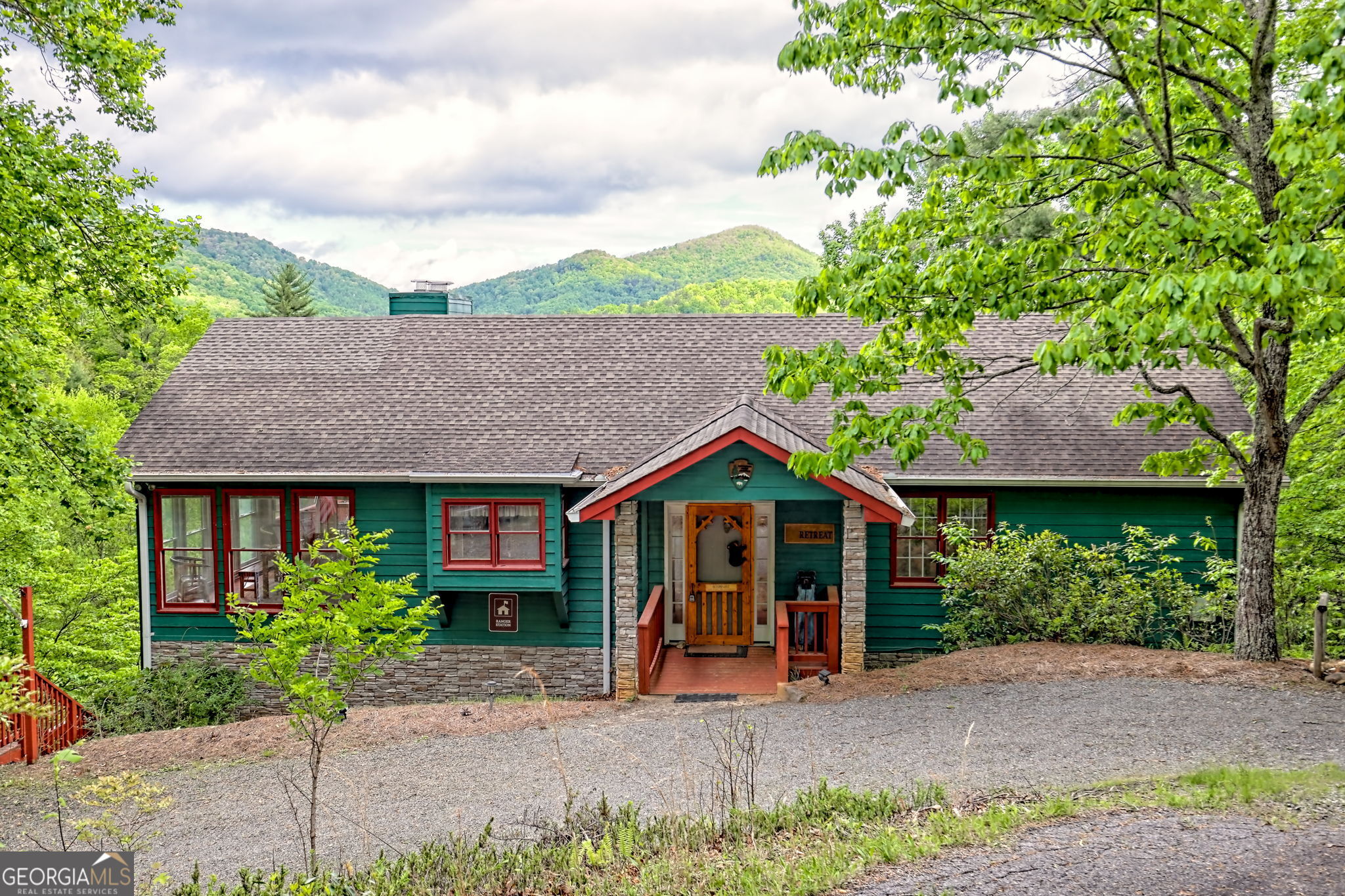TURN-KEY ~ LONG-RANGE VIEWS ~ NO HOA!!! Perfect location for a short-term rental. Bordering the National Forest, this 3,056 sq ft mountain home offers exceptional privacy and breathtaking long-range views of the Northeast mountains. With an open-concept design and expansive windows, the home is filled with natural light and uninterrupted scenery. The main level includes two bedrooms, a full bathroom, a spacious and cozy living room with a fireplace, and a large kitchen perfect for entertaining. Enjoy meals and quality time in the screened-in outdoor dining area, or step onto the expansive open deck-an ideal spot for stargazing with no light pollution to obstruct the night sky. The lower level features a third bedroom, a full bathroom, a flex room currently used as a TV room, and a game room complete with a POOL TABLE, ARCADE GAME, and much more. There's also a generous unfinished space with a private side entrance ready to be customized to suit your needs. With no HOA and plenty of room to relax, gather, and grow, this home combines comfort, style, and the serenity of true mountain living.