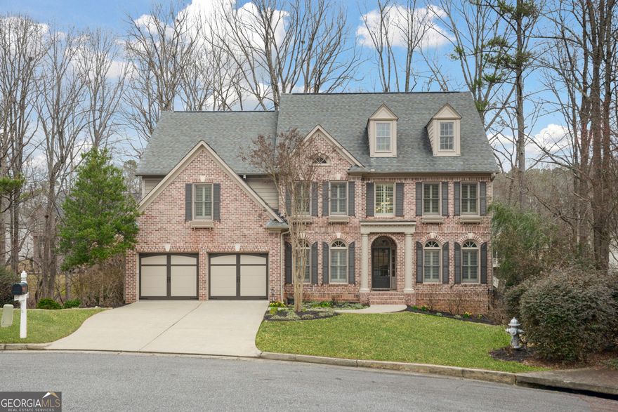 Situated in a quiet cul-de-sac with private manicured backyard oasis overlooking a creek, this meticulous home offers a truly luxurious lifestyle.  Located in sought after Woodmont Golf & Country Club community, offering top ranked schools and resort style living which includes tennis, pickleball, competition swimming and social activities for all ages.  This 5-bedroom, 4 full bath home is complete with an open floor plan, kitchen with view of the 2-story Great Room.  The inviting Foyer is flanked by a separate Dining Room and Living Room/office.  There is a guest suite located on the first floor.  The second level showcases the oversized Primary Bedroom Suite complete with 2 closets,  exercise space and office/nursery area.   There are 3 additional bedroom suites on the upper level.  An unfinished basement, stubbed for a bath has a world of possibilities for the new owner.