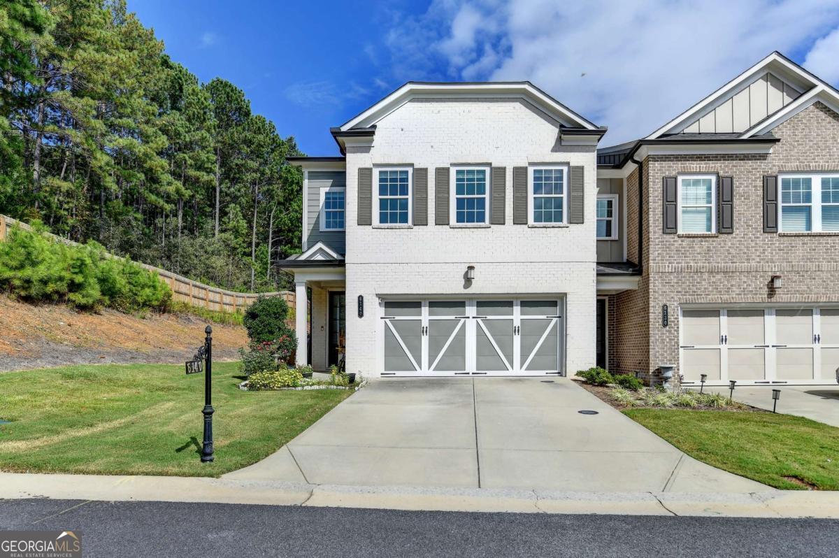 Welcome to this stunning END UNIT townhome located in the desirable, gated swim community of Magnolia Walk. This beautifully maintained 3-bedroom, 2.5-bath home boasts modern finishes and a thoughtfully designed layout, making it perfect for both relaxation and entertaining. Key Features & Highlights * LVP Flooring: Gorgeous Luxury Vinyl Plank flooring flows seamlessly throughout the main level, offering both durability and style. * Gourmet Kitchen: The chef's kitchen features quartz countertops, stainless steel appliances, and crisp white cabinets, opening to the spacious family room-a perfect space for gathering with loved ones. * Open Concept Living: The family room is flooded with natural light from a wall of windows, with a cozy gas fireplace as the focal point. The adjacent breakfast room overlooks the beautiful backyard with a private covered patio, perfect for outdoor relaxation. * Main-Level Powder Room: A charming powder room on the main level adds convenience for guests. * Two-Car Garage: Ample parking with a 2-car garage. Upstairs Retreat * Spacious Master Suite: The master suite features trey ceilings and an ensuite bath with a separate shower and garden tub, double vanities, and an enlarged walk-in closet-providing a true retreat. * Two Additional Bedrooms: Two generously sized bedrooms share a full bath with double vanities, offering comfort and privacy for family or guests. Exterior & Location * Private, Landscaped Backyard: Enjoy the outdoors with a beautifully landscaped and relaxing rear patio. * Convenient Location: Ideally located near downtown Alpharetta, GA 400, and top shopping, dining, and parks-Halcyon, Avalon, and Fowler Park are just minutes away. Plus, enjoy the best of Forsyth County taxes with an Alpharetta address! The HOA covers all amenities, exterior building and lawn maintenance, and trash services, making for an easy, low-maintenance lifestyle. Don't miss your chance to see this beautiful home-schedule a tour today and experience all it has to offer!