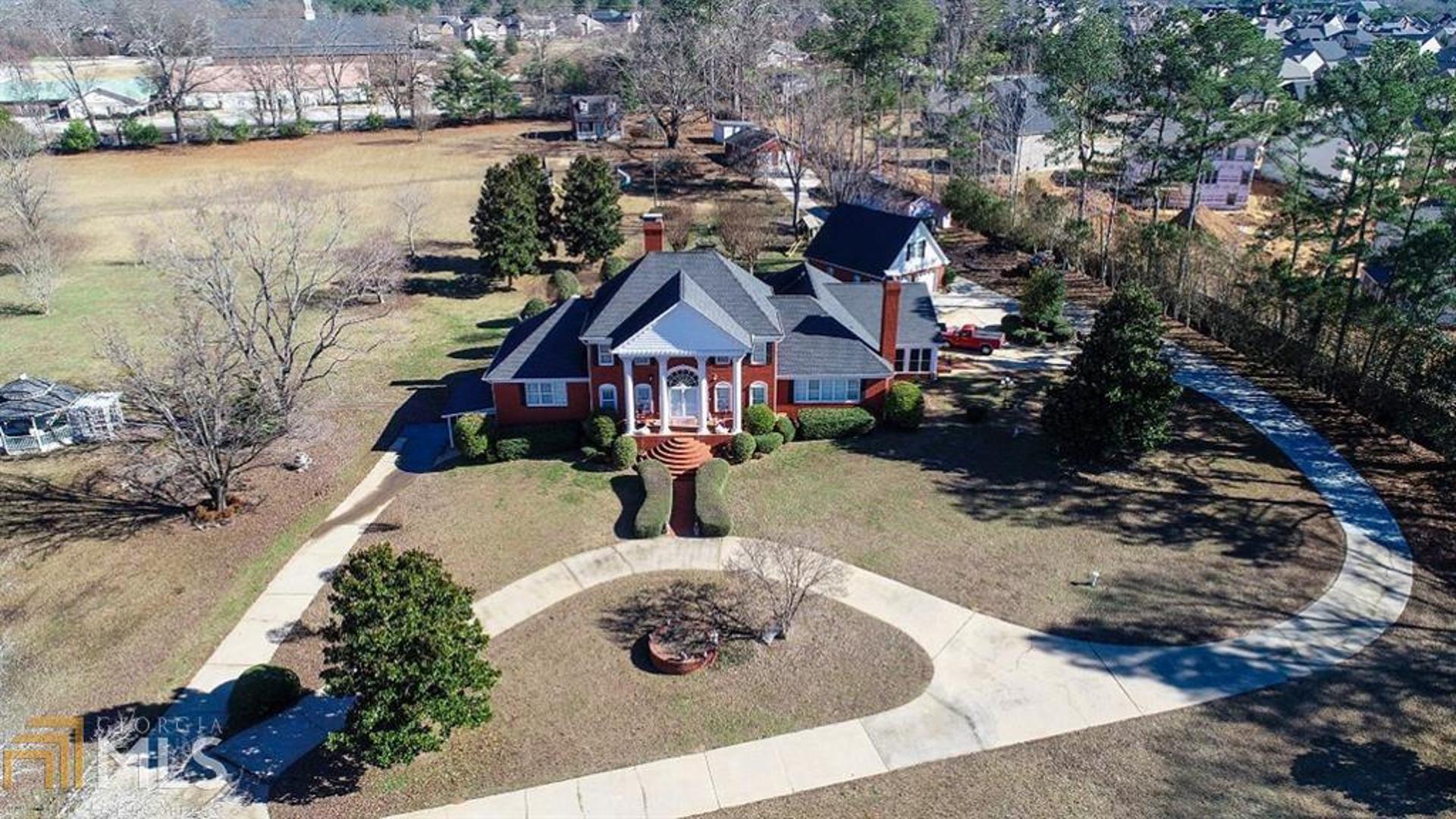 Lovely sprawling acreage with an abundance of potential and land. This property is gated, please see showing instructions for gate code. Home site is 17.4 acres + or -. Owner will consider selling property as whole or separating home & 5 acres track + or -. Land is gently sloping & has traffic light at corner of property.
