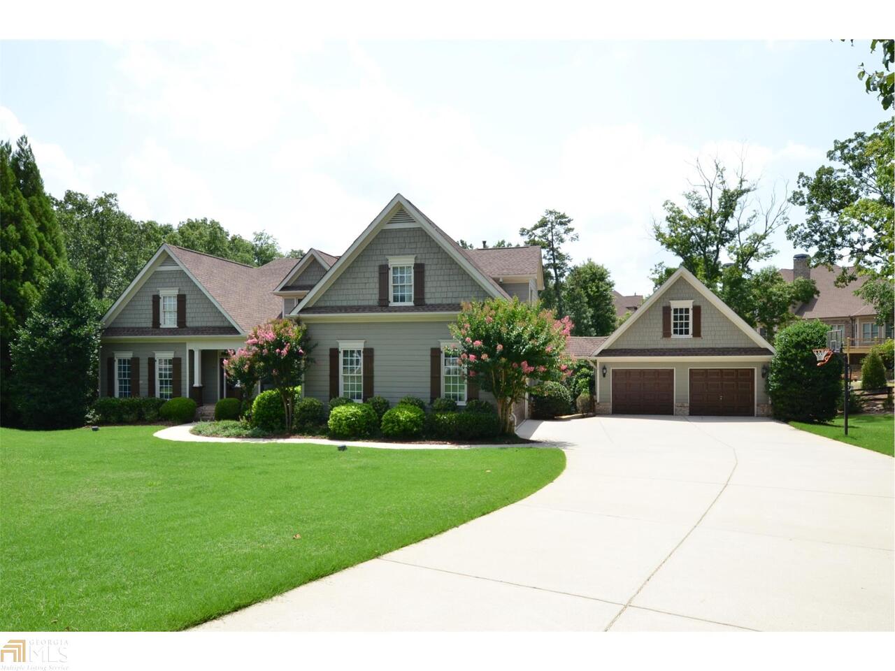NESTLED on a private cul-de-sac lot in South Forsyth's Premium Equestrian Community on the Banks of the Chattahoochee River!! CUSTOM - not another home like this one in CRC. Over 6,000 sf finished with 4-car garage! Vaulted foyer & a formal dining room with a trey ceiling, transom windows, & shadow boxes. Classic fireside family room. Chef s kitchen with deep stained cabinets and SS appl. Main level master retreat with an outstanding closet system. Absolutely fabulous terrace level suite/apartment with a bedroom, bathroom, built-in theatre, rec room, and kitchen!