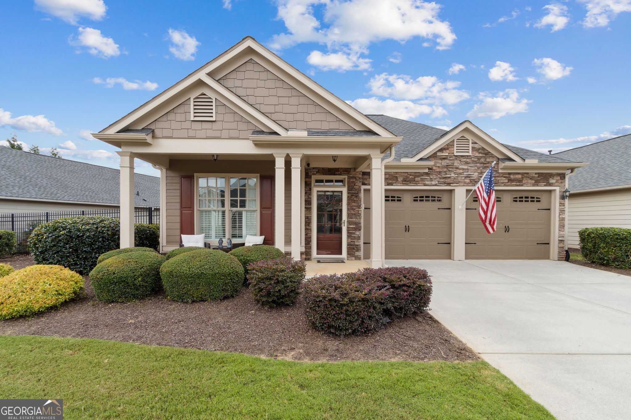 Easy Living in Windsong at Seven Hills - 55+ Active Adult Community This beautifully designed ranch plan offers the perfect blend of comfort and convenience for an active lifestyle. The open living area, highlighted by a stunning stone fireplace, is ideal for relaxed evenings or hosting friends and family. The chef's kitchen makes cooking a joy, with granite counters, stainless appliances, and a built-in coffee/wine bar for your favorite indulgences. The owner's suite is a private retreat with a custom California Closet and spa-inspired tile bath. Secondary bedrooms are spacious and bright-perfect for visiting guests or hobbies. Upgrades like hardwood floors, plantation shutters, and surround sound bring both style and comfort to everyday living. Permanent attic stairs provide easy access to abundant storage, while the private patio and garden area offer a peaceful place to enjoy your morning coffee or unwind in the evening. As a resident of Windsong at Seven Hills, you'll enjoy more than just a home-you'll be part of a vibrant 55+ community with resort-style amenities including swim, tennis, and miles of nature trails. Plus, shopping, groceries, and dining are just minutes away.