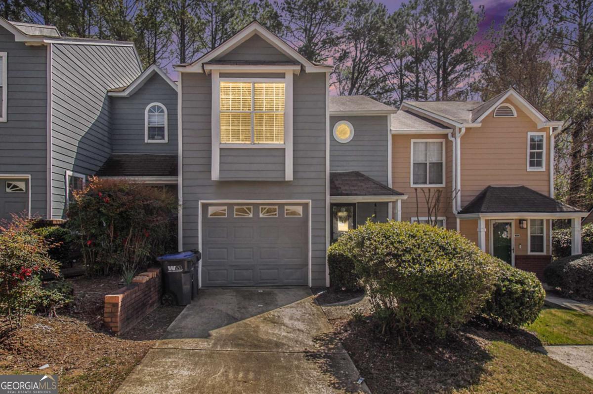This townhome is ready for you to move right in! With n impeccably maintained 2-bedroom, 2.5-bath townhome in vibrant Overlook Green. With 1,254 sq ft of living space, this home offers a refreshed, open-concept layout that includes a cathedral-ceiling living room, cozy gas fireplace, and an updated kitchen with stainless gas range. The upper level boasts an oversized primary suite featuring a beautifully renovated bathroom-subway tile, frameless shower glass, granite counters, and dual vanities. Step outside to your private backyard patio, and enjoy the peace of community living with a pool and low-maintenance monthly HOA. Whether you're a first-time buyer, downsizer, or investor, this property delivers move-in ready quality, strong resale potential, and a prime location with easy I-85 access.