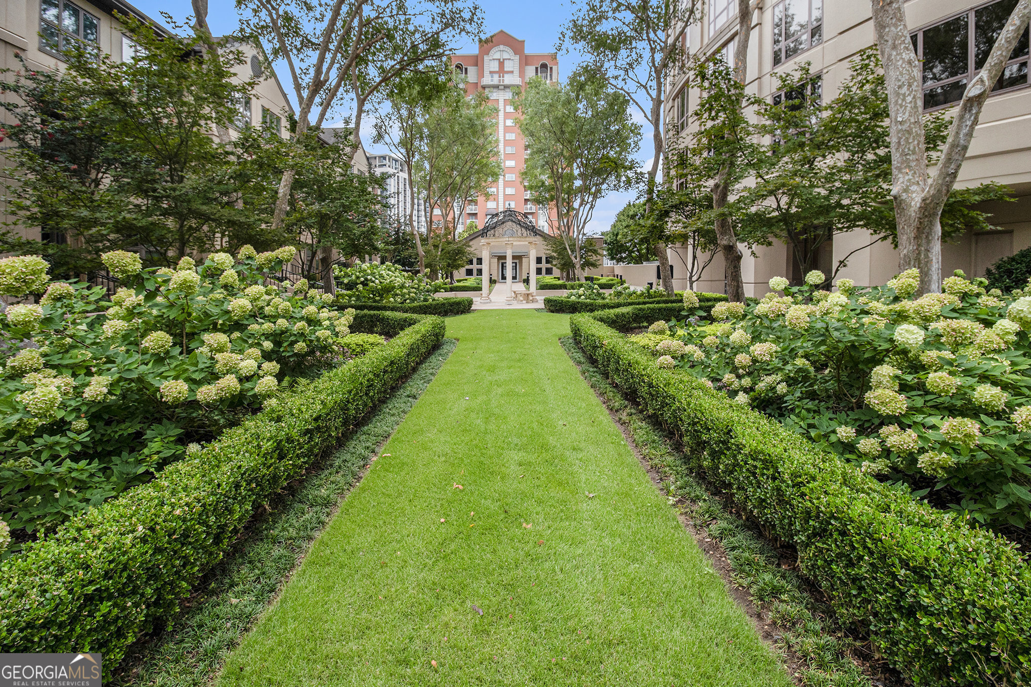 Welcoming spacious 1-bedroom, 1-bathroom condo nestled in the heart of Buckhead, Across from Lenox Mall and Phipps Plaza-Atlanta's premier residential and commercial district. This bright, open-concept unit offers a generous living area, a well-appointed kitchen, a large bedroom with an en-suite bath and walk-in closet, plus a convenient half bath for guests. Enjoy peaceful city views from your private balcony and the comfort of hardwood floors, high ceilings, and abundant natural light. Residents of this full-service building enjoy resort-style amenities including a swimming pool, fitness center, clubroom, gated access, concierge service, and secure parking. One of the community's most beloved features is its beautifully landscaped private garden. Just steps from Lenox Square, Phipps Plaza, Whole Foods, Trader Joe's, and some of Atlanta's best restaurants and cafes. With easy access to MARTA and GA-400, commuting is a breeze. Don't miss your chance to live in one of Buckhead's most convenient and charming communities!