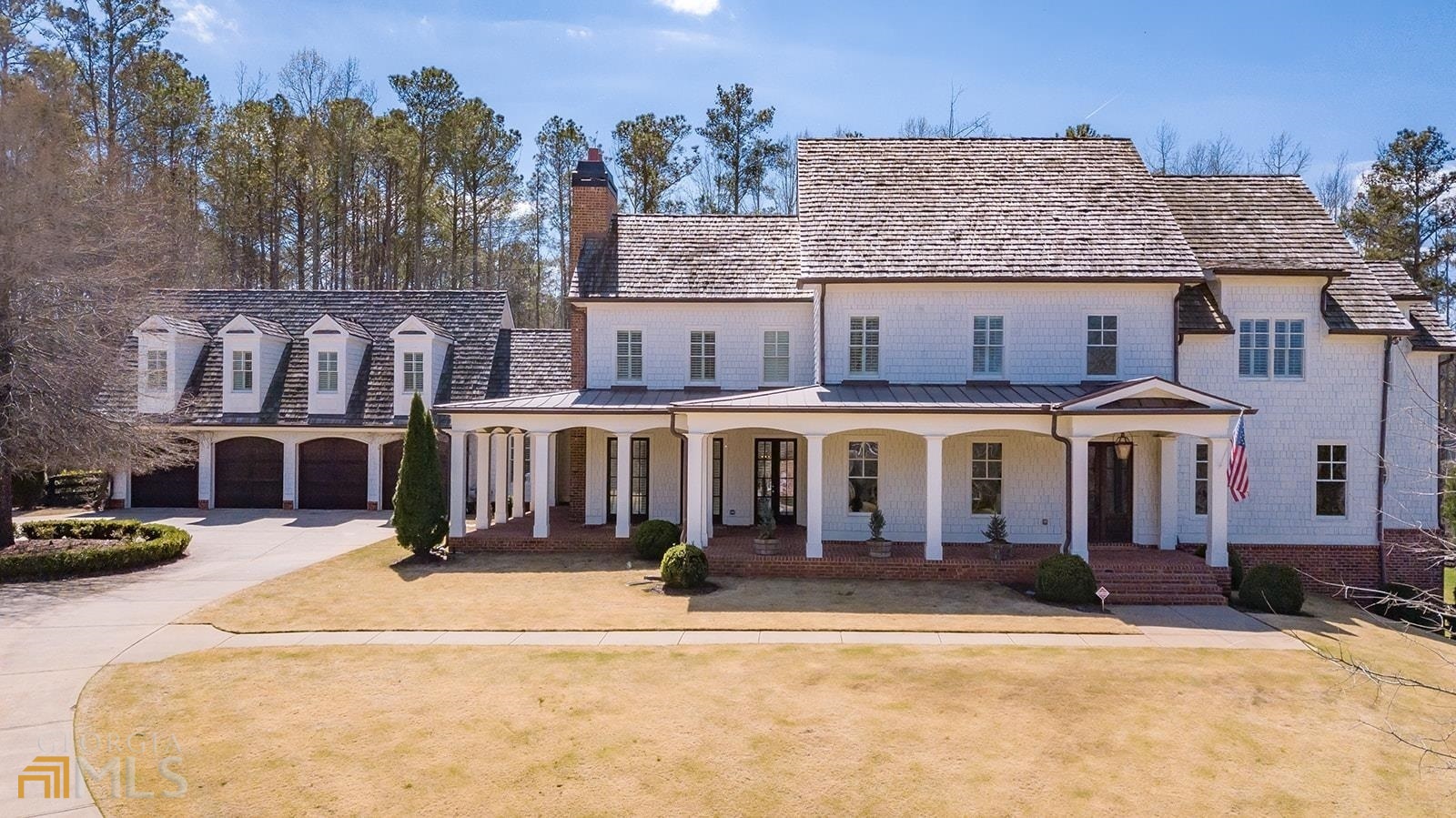 Urban, modern farmhouse living in prime location. Featured in 2016 Southern Living. A few miles from downtown Alpharetta, Avalon, Crabapple and 400! Built by Steven Powell & renovated inside and out by T-Olive properties in 2015. A luxury 7 bedroom, 9 bathroom home with multiple En-suites & coffered ceilings. Master-on-main, Kohler IPAD controlled shower, heated marble floors, hand bricked fireplace, huge MTI Parisian2 self- standing, self-cleaning spa tub & designer closet with island, mirrors & built- in's. Chefs kitchen open to family room, 2 dishwashers, 2 farmhouse sinks with Waterstone faucets, WOLF 6 burner gas cooktop with 2 ovens, 2 Sub-Zero Refrigerators & Island with 3 inch Carrera Marble. Large Family Room w-stacked stone fireplace and wrap around floor to ceiling glass doors. Lutron lighting system, upgraded lighting fixtures and chandeliers. Sonos sound system for entire home. Fabulous 4 car garage with circular driveway. Home has 6 fireplaces, 3 kitchens & multiple ensuites. Sonos Sound system for entire home. Fabulous 4 car garage with circular driveway, 4 board fencing & invisible dog fence. Amazing backyard, heated salt water pool & outdoor fireplace! Exquisite gym. Au pair suite over garage. Entire home is functional finished space and intimately designed.