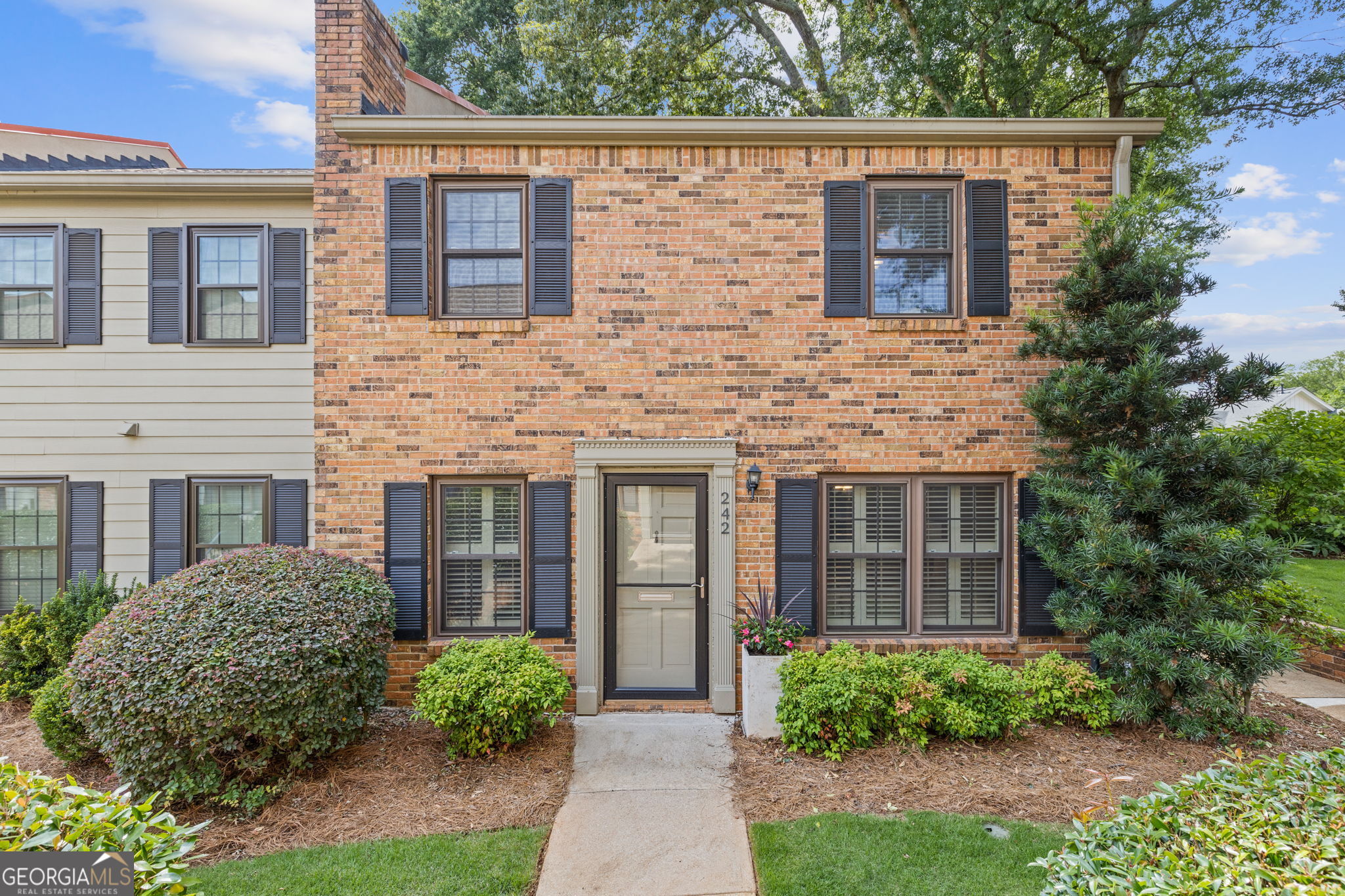 Welcome home to Richmond Green community! This owner occupied community of only 18 townhomes is a short walk from Decatur Square. Enjoy Adair Park, including a playground, picnic area and dog park practically across the street. This beautifully updated brick end unit features 3 bedrooms, 2.5 bathrooms, and has over 1,600 square feet of custom interior finishings. This luxurious home offers top grade oak hardwood floors throughout, large newly renovated kitchen with quartzite countertops, new cabinets with built in dual pantries, cook top island, and recessed LED lighting on a dimmer. Enjoy the inviting courtyard via french doors leading to your private oasis with top grade artificial grass completing the beautiful back yard perfect for private outdoor living and entertaining. Step into the primary suite complete with ensuite full bath, walk-in closet and French doors leading to the heated and cooled sunroom overlooking your private courtyard and backyard green space for that perfect place to relax. Other features include updated windows, all LED lighting, one year new roof with a 40 year life expectancy, 2 Nest thermostats, 2 HVAC units for ease of staying comfortable throughout the year, one-car carport along with plenty of extra parking for a second car. Richmond Green is located a short distance from downtown ATL, St. Thomas More and City of Decatur schools, Agnes Scott College and Emory University/Hospital, CDC, and all the welcoming shops and restaurants of Decatur. Listing broker and seller are related.