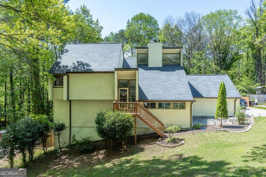 Look no further! Gorgeous home in one of the best Cobb County school districts. Located in a cul-de-sac surrounded by beautiful trees. NO Association Fees. New backsplash and granite countertops. New LVP flooring, hardwood flooring, and carpeting throughout. Newly updated kitchen with granite countertops and plenty of space to enjoy meals with family and friends, updated bright bathrooms with new showers and tubs. FULL FINISHED basement updated with LVP flooring and ceiling tiles, great for office space or playroom.  New HVAC, New roof, New Deck, New roof! There is an attached garage and a detached garage that can be used for storage or a workshop, with endless possibilities. Schedule your visit today!