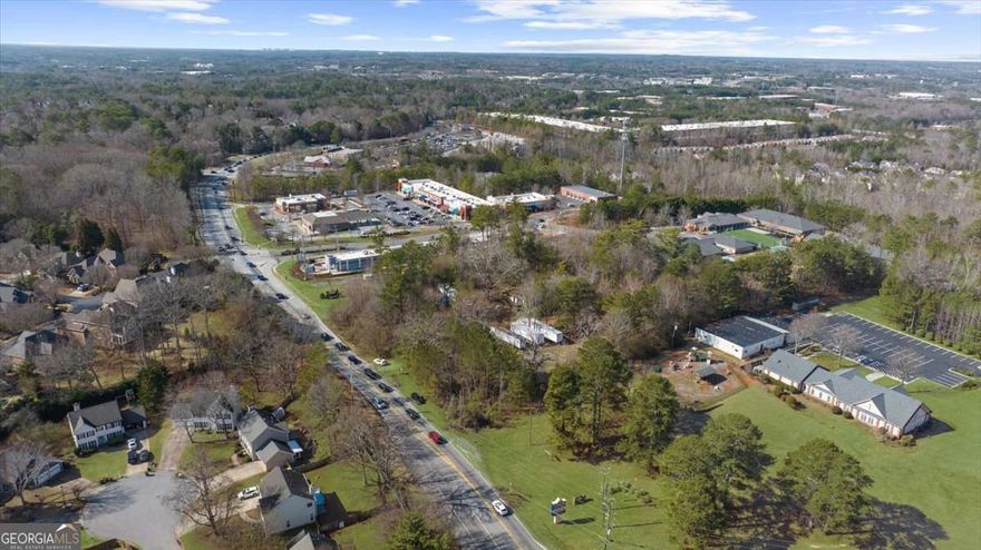**Prime Commercial Opportunity in Alpharetta!**    Welcome to 5370 McGinnis Ferry Road, a 2.23-acre commercial lot offering endless possibilities. This relatively level, flat property is the perfect canvas for your dream business. While an existing structure is on-site, itCOs ready to be cleared, making way for new development. The impressive road frontage on McGinnis Ferry is sure to impress, as it will grant excellent visibility for your new business given it is a main thoroughfare and close to so many popular destinations!    Located in a high-demand area near a Publix anchored shopping center at McGinnis Ferry Road and Windward Parkway, popular fast-food chains, thriving residential communities, top-rated schools, affluent demographics, and major roadways, this lot boasts unbeatable visibility and accessibility. Whether you're planning a retail space, storage units, office complex, or service-oriented business, this prime location is ready to bring your vision to life.      Seize this opportunity to invest in AlpharettaCOs booming growth corridor!