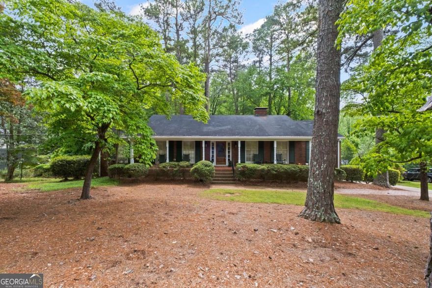 This is your chance to get a full 1 acre property in Whitlock Heights!  Enjoy the convenience and prestige of this sought after neighborhood.  Just imagine sitting on this expansive covered front porch with your favorite beverage watching the days turn into night without a care in the world.   Or make the quick walk/ride to Marietta Square for an evening out.  You could also be enjoying your large sunroom and FINISHED BASEMENT with FULL KITCHEN and bath.  This home has more space than most in the neighborhood.  Come see it before it's gone!