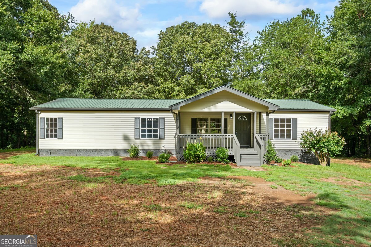 Homes like this don't become available often so contact your Realtor now to schedule your private showing before it's gone! Jasper county schools! UNBEILEVABLE location with lots of PRIVACY on 5 ACRES! This home sits approx. 200 feet off the road with almost 300 feet of road frontage. RENOVATIONS include NEW flooring, NEW interior & exterior paint, BRAND NEW kitchen with stainless appliances & granite countertops, BRAND NEW bathrooms, NEW light fixtures, NEW plumbing fixtures & NEW water heater. Additional features include a metal roof, HUGE covered front porch, split bedroom floor plan, walk-in closets in each bedroom, low maintenance exterior siding & level yard (great for kids & pets). Sip your morning coffee with no one in sight while watching the deer and listening to the bird's chirp. Centrally located to Jackson, Monticello, Covington, Madison & McDonough and just minutes away from Jackson Lake.